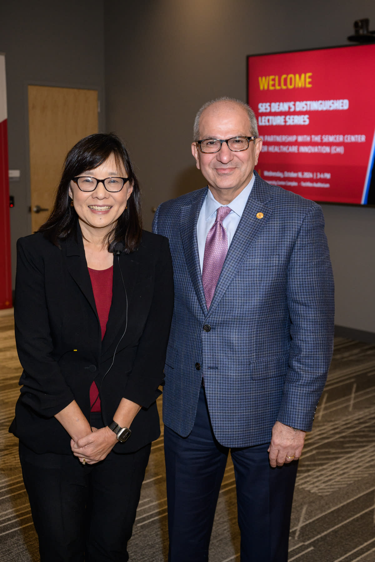 Rebecca Li (left) poses next to Stevens president Nariman Farvardin