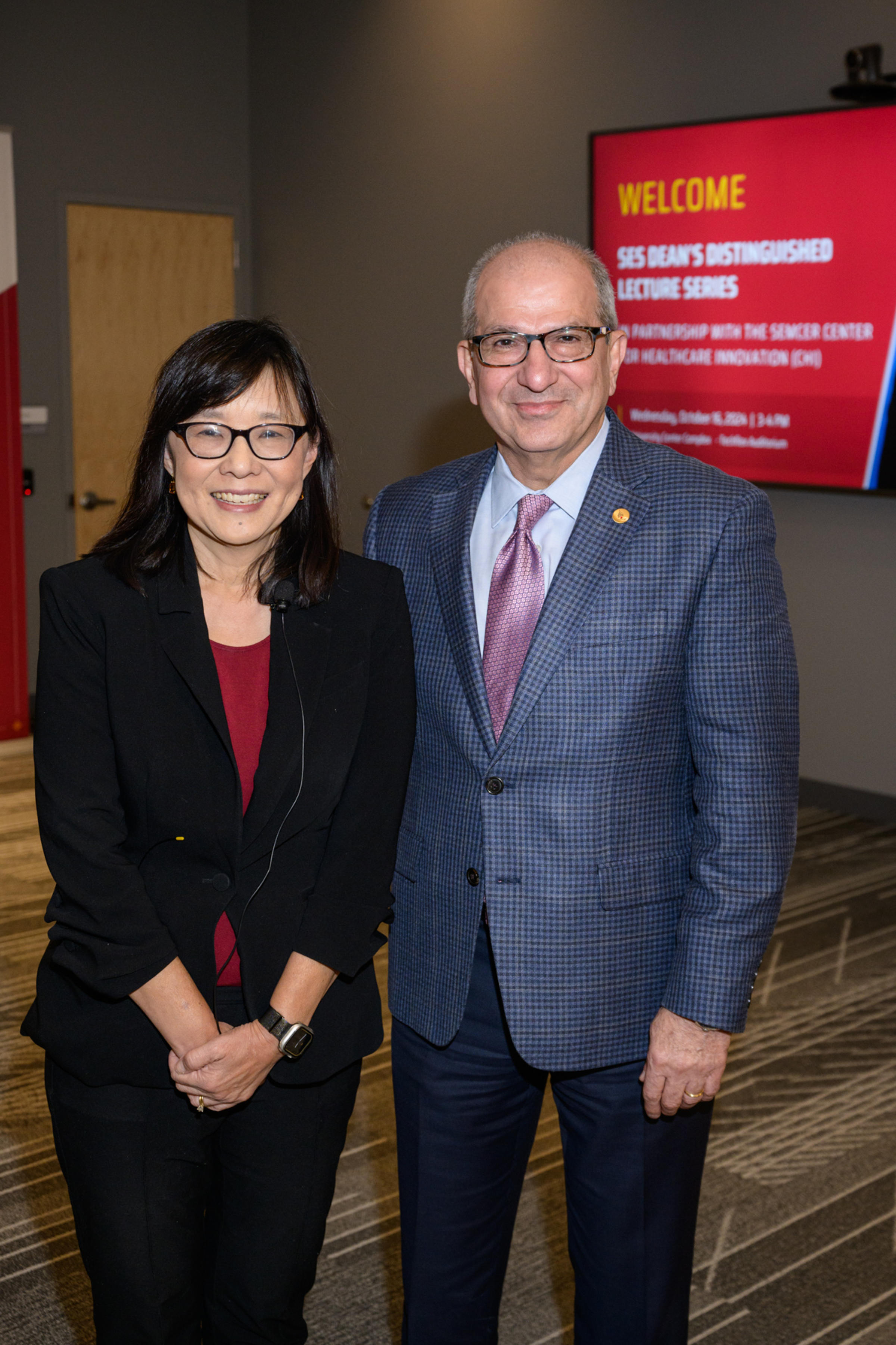 Rebecca Li (left) poses next to Stevens president Nariman Farvardin