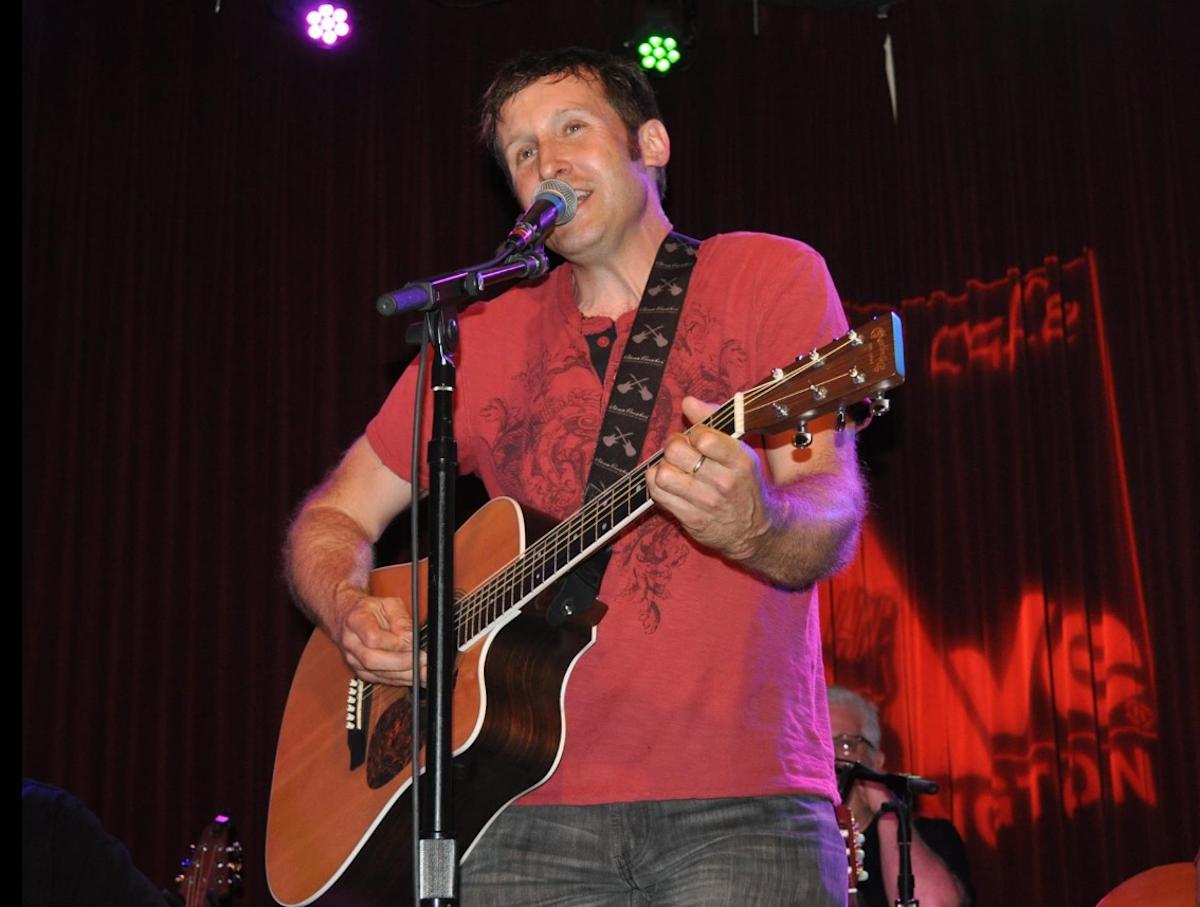 Chuck Schaeffer performing on stage singing