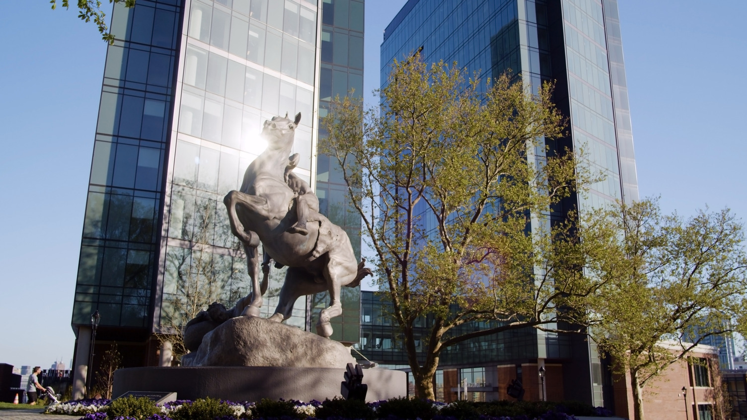 Torchbearer statue with the University Center Complex towers in background