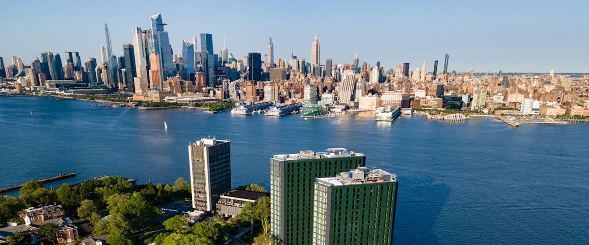 An aerial view of campus with New York City as the backdrop