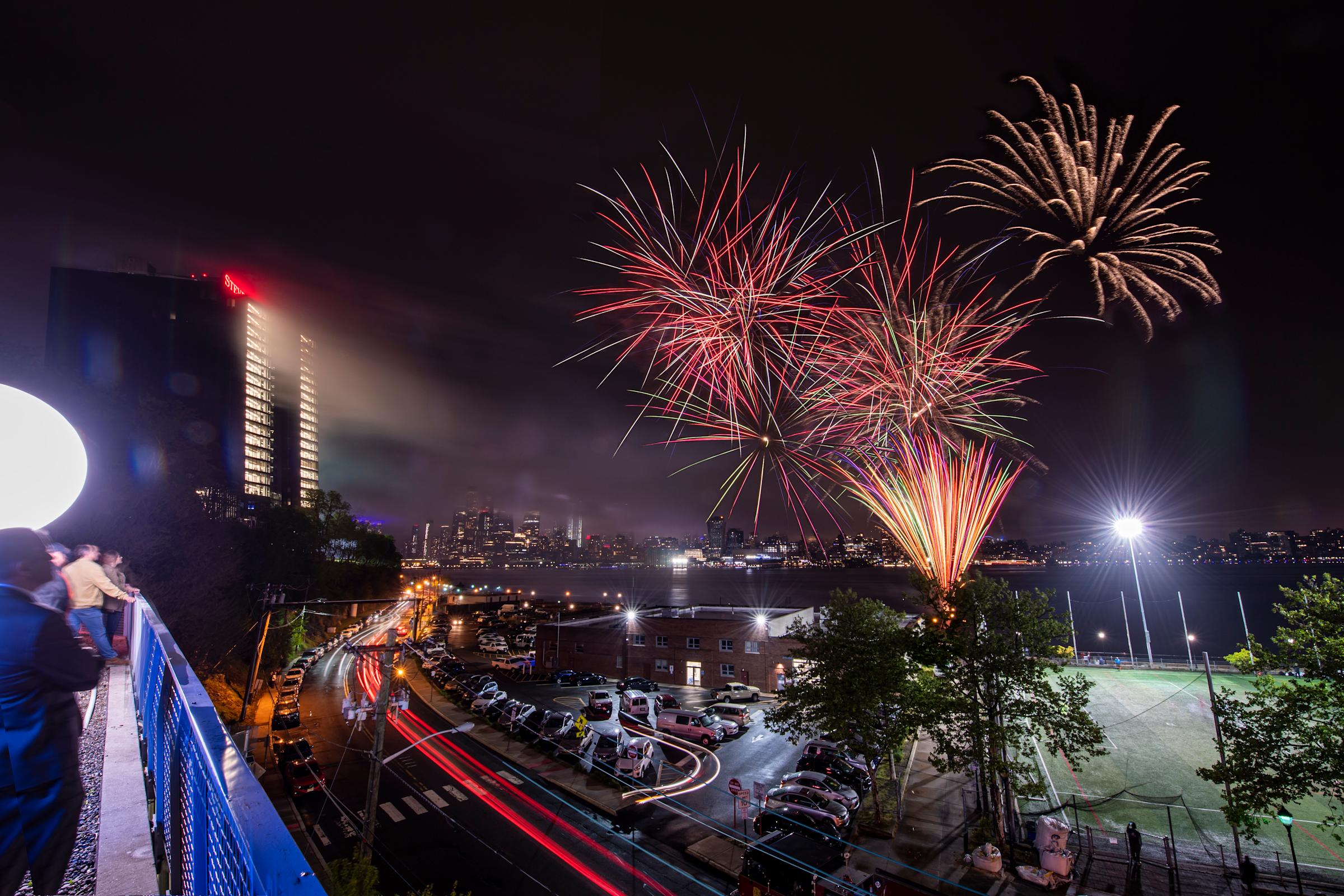 UCC Illumination with fireworks over Hoboken at night.