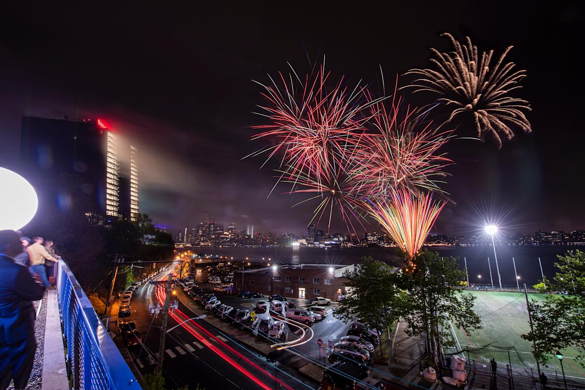 UCC Illumination with fireworks over Hoboken at night.