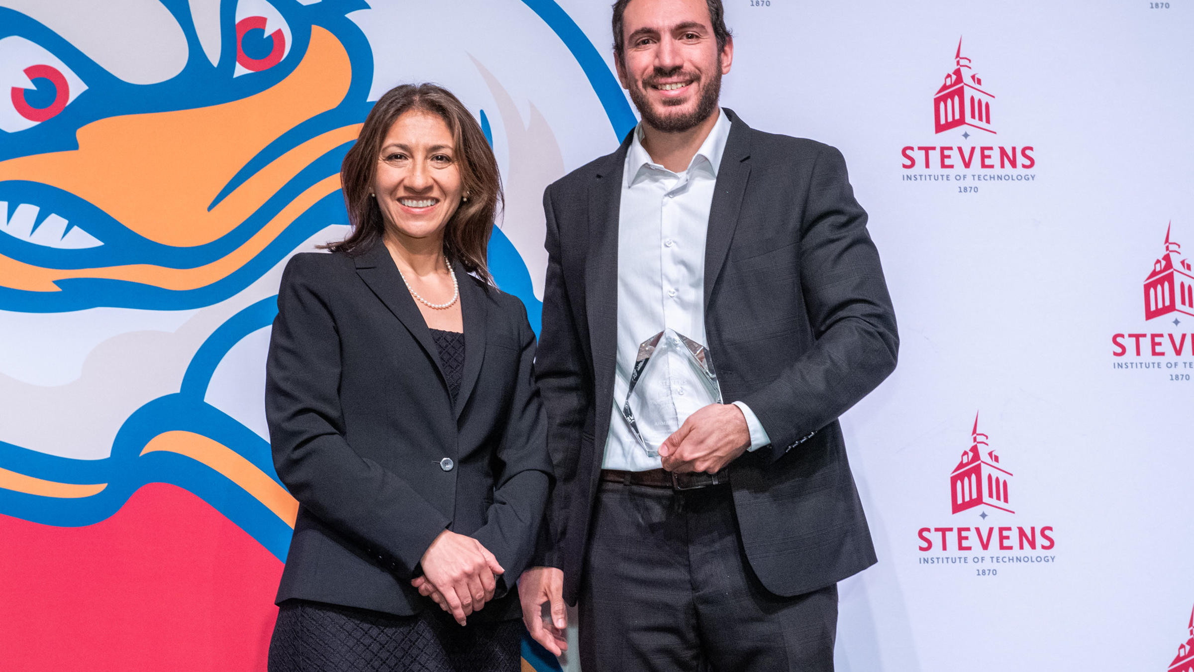 An image of a graduate award presenter and recipient at the 2026 graduate awards ceremony.