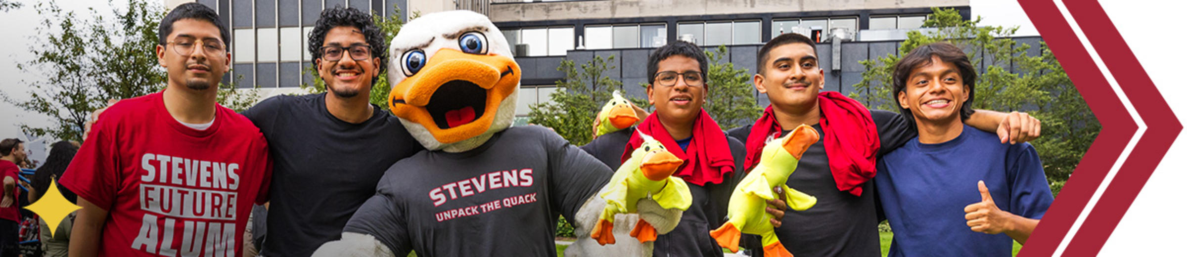 Five students smile for the camera with Attila the duck.