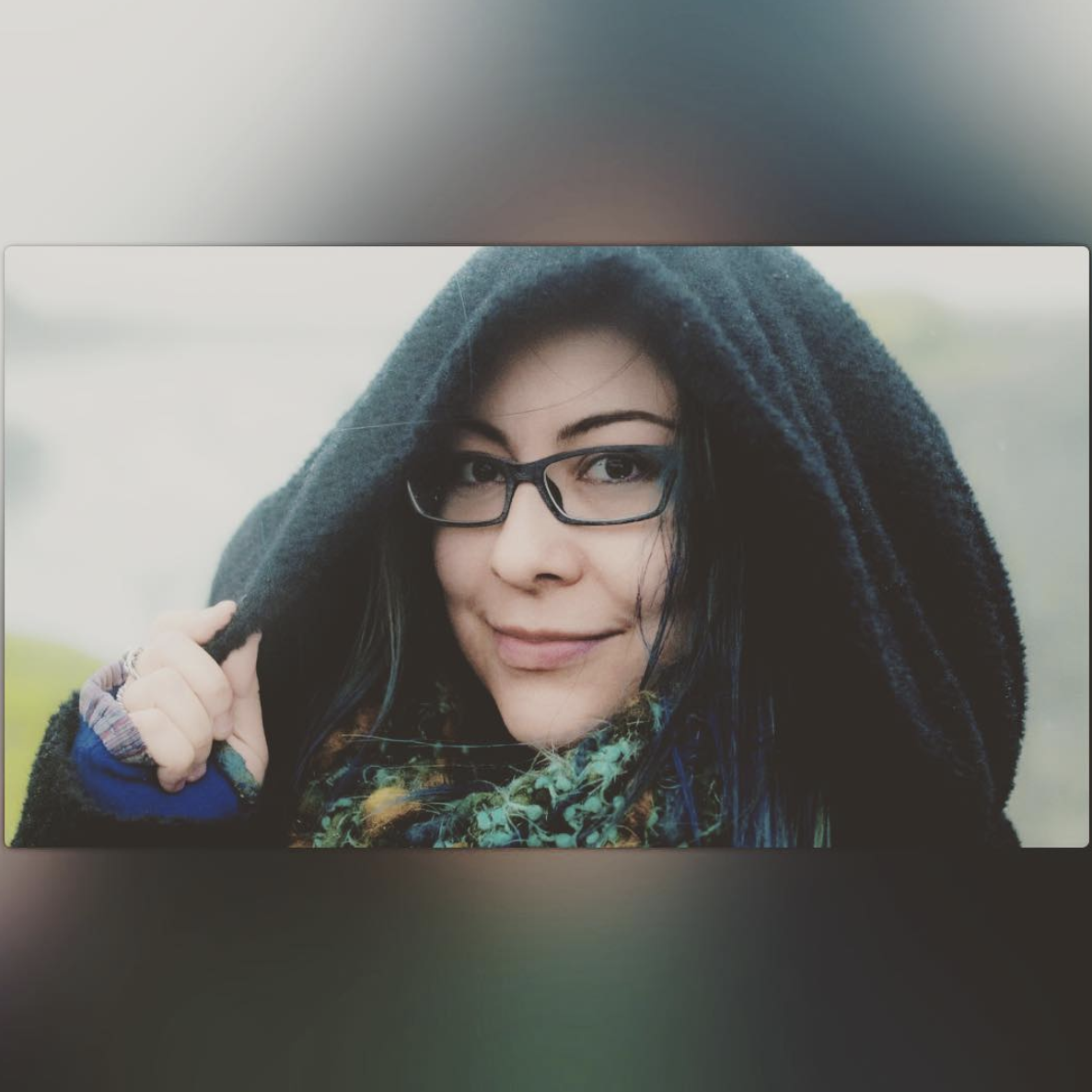 A photo of Julia Howe with a black hood on her head. 