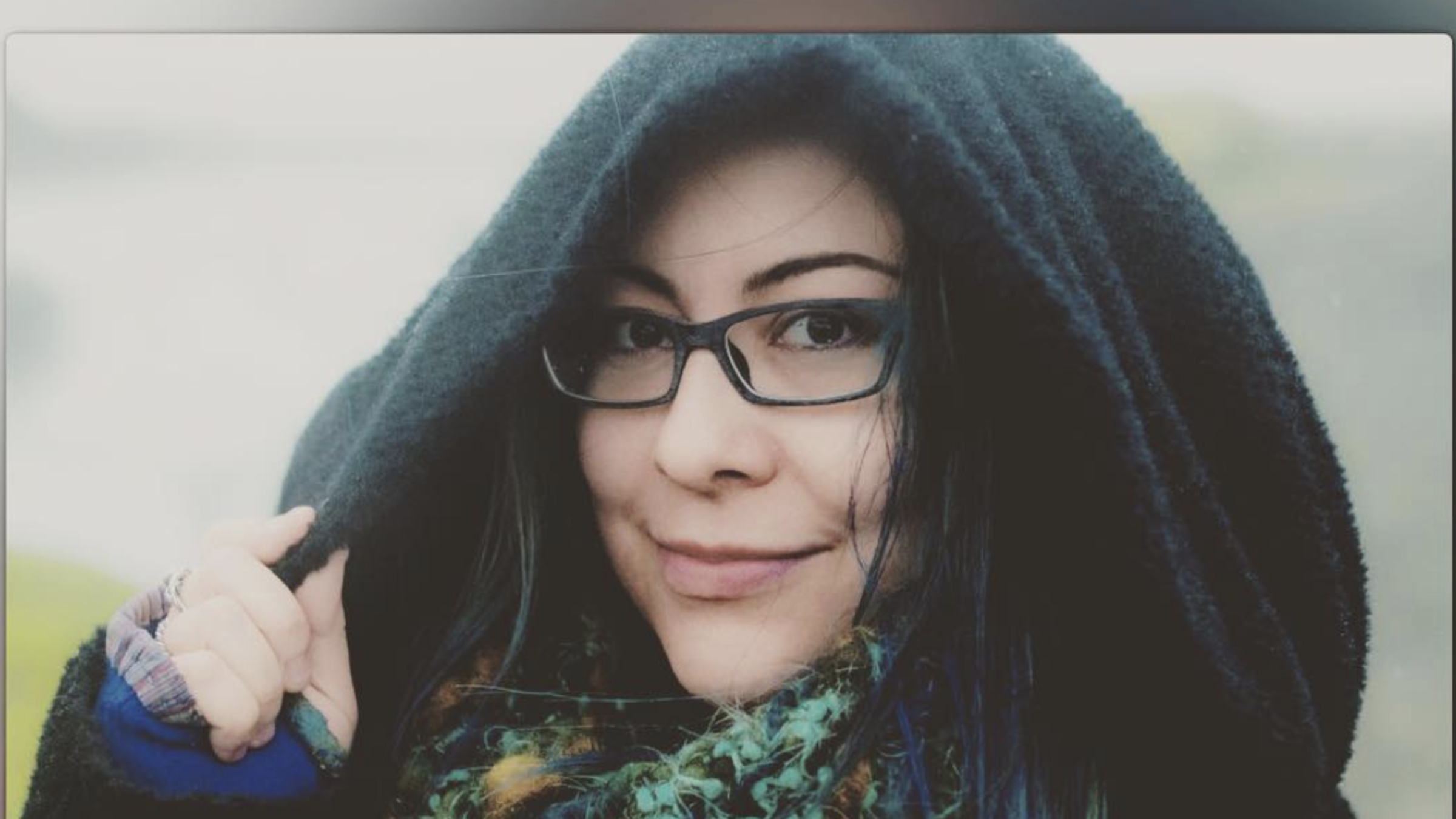 A photo of Julia Howe with a black hood on her head.