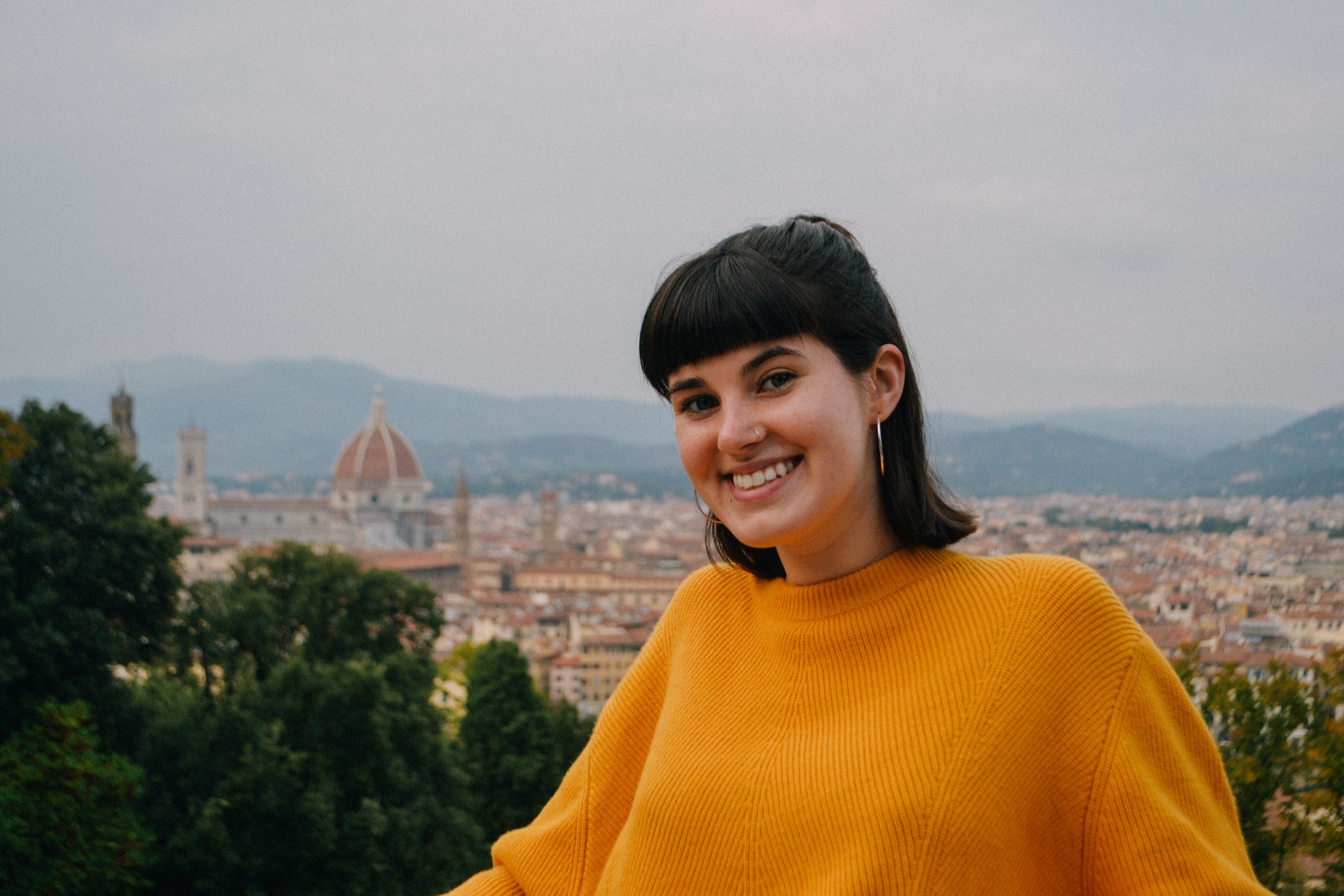 Kelly McGowan in the foreground with the city of Florence in the background