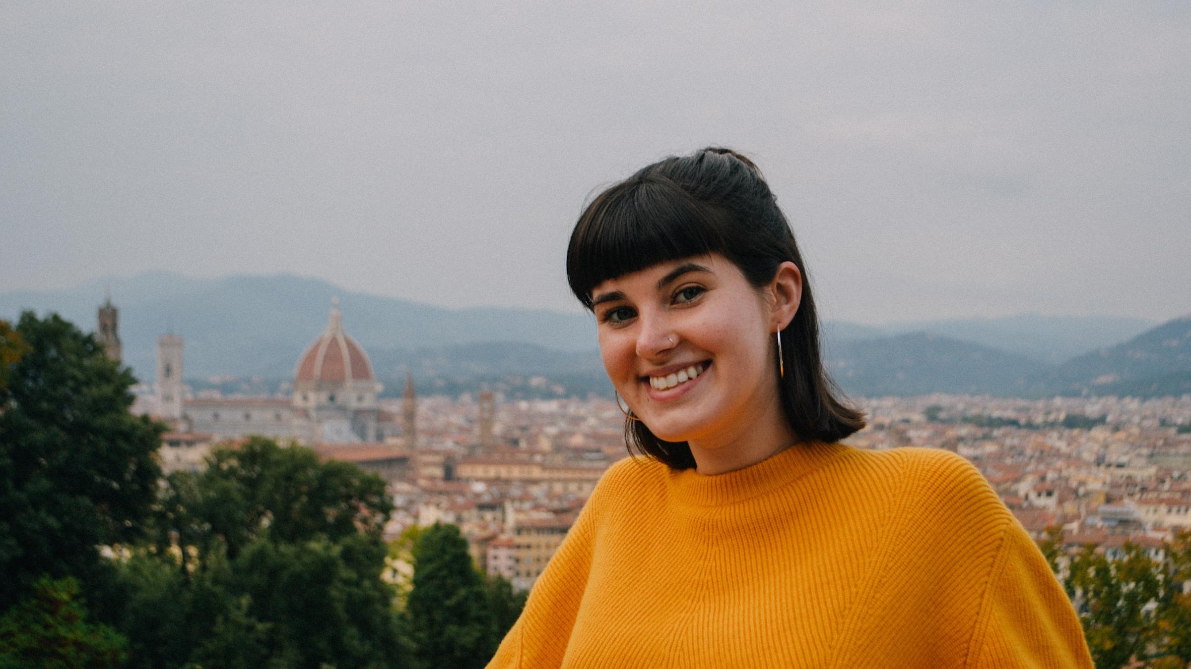 Kelly McGowan in the foreground with the city of Florence in the background