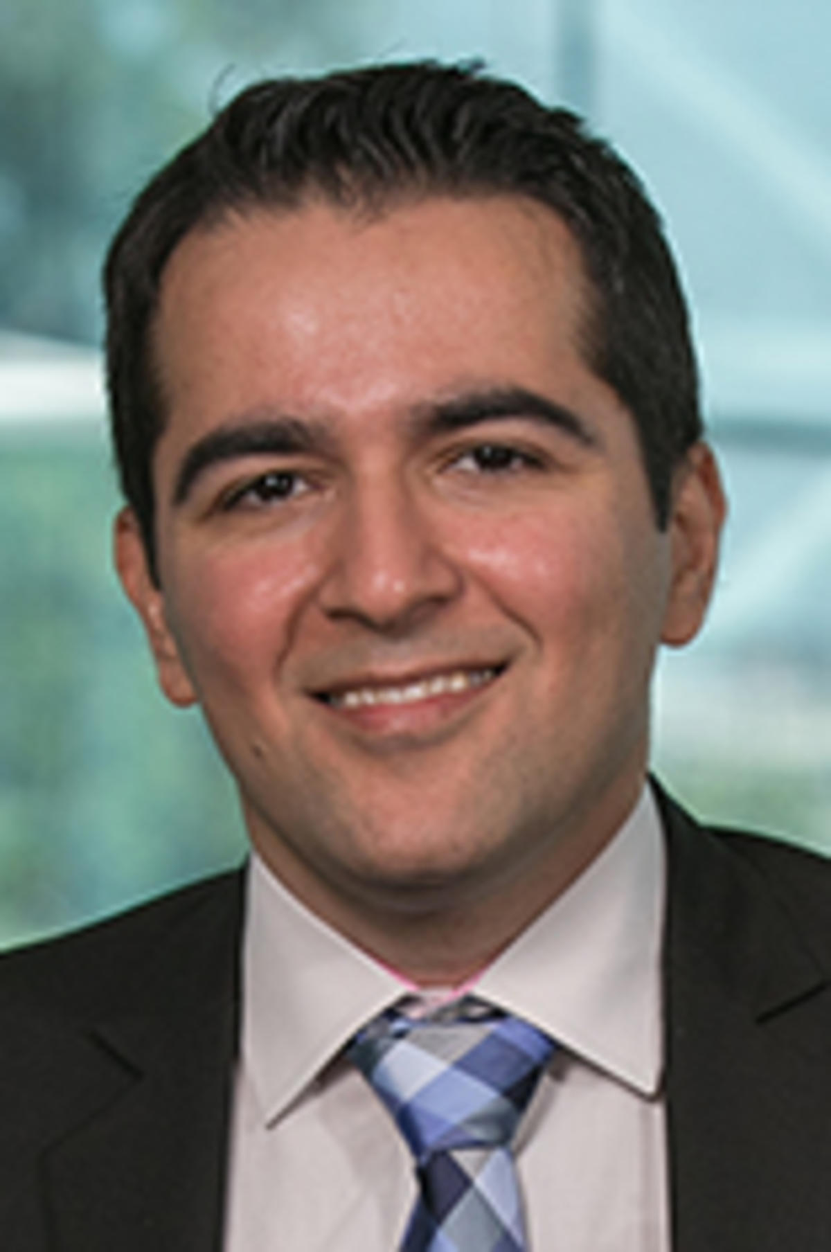 Headshot of Dr. Amir Gandomi with the New York City skyine in the background.