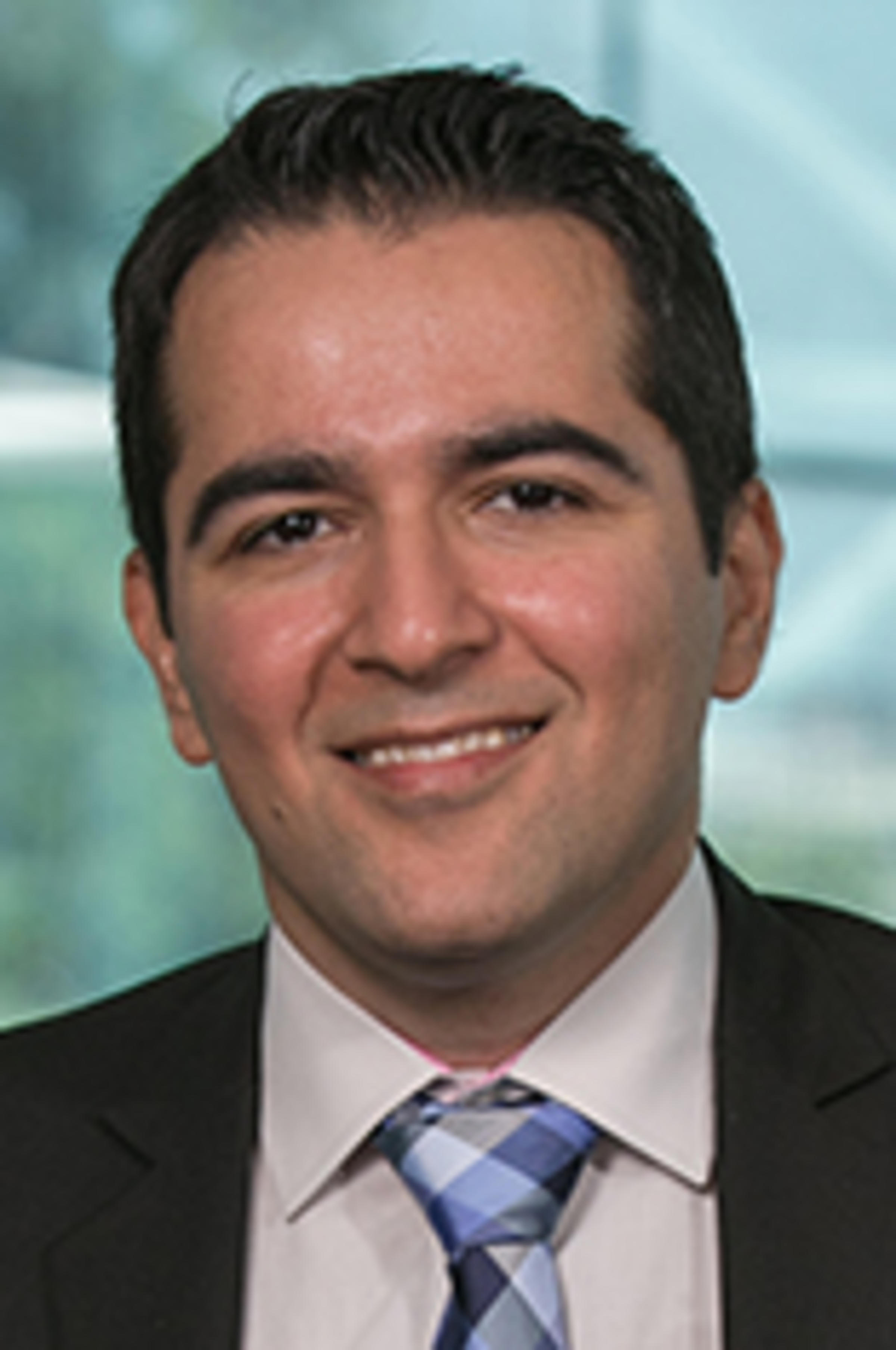 Headshot of Dr. Amir Gandomi with the New York City skyine in the background.
