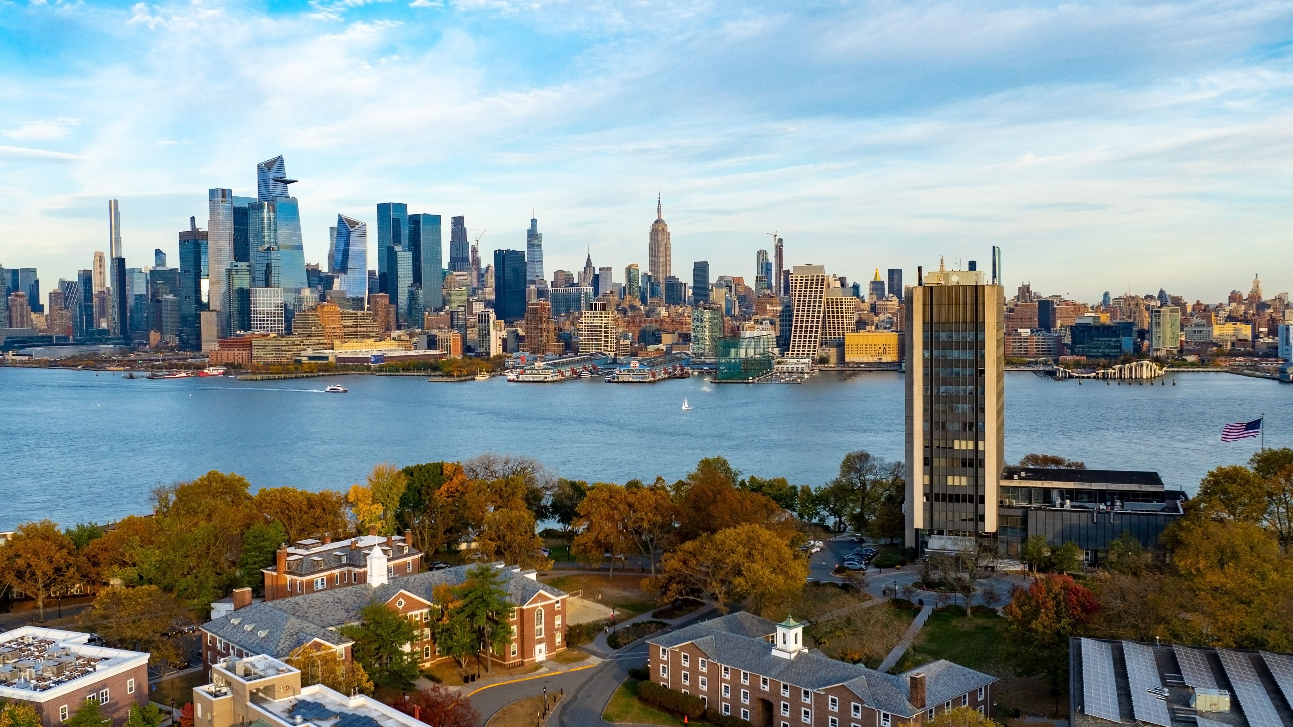 Aerial image of campus with New York skyline in background