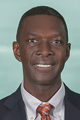 Headshot of Papa Ndiaye with New York City in the background.