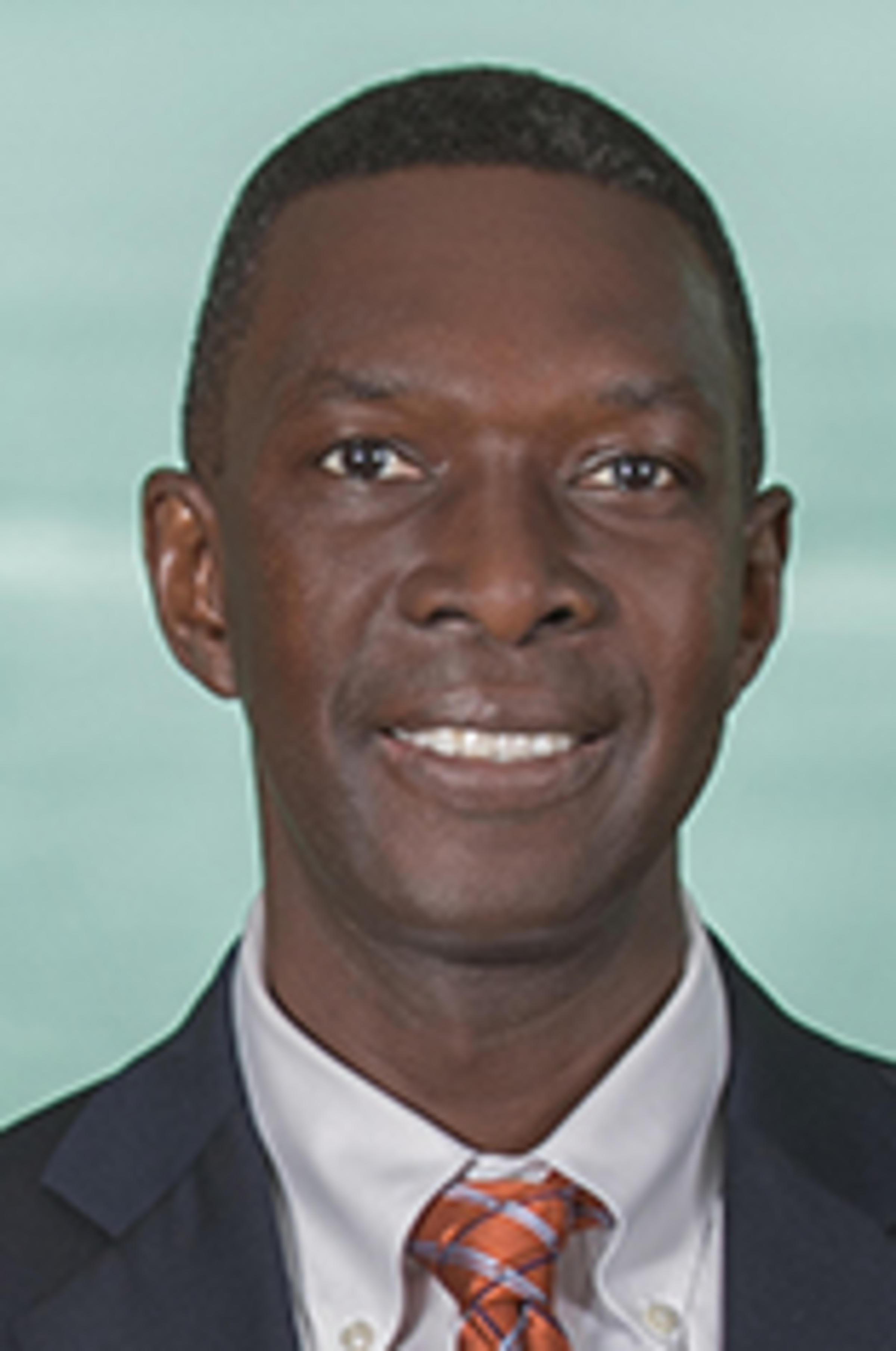 Headshot of Papa Ndiaye with New York City in the background.