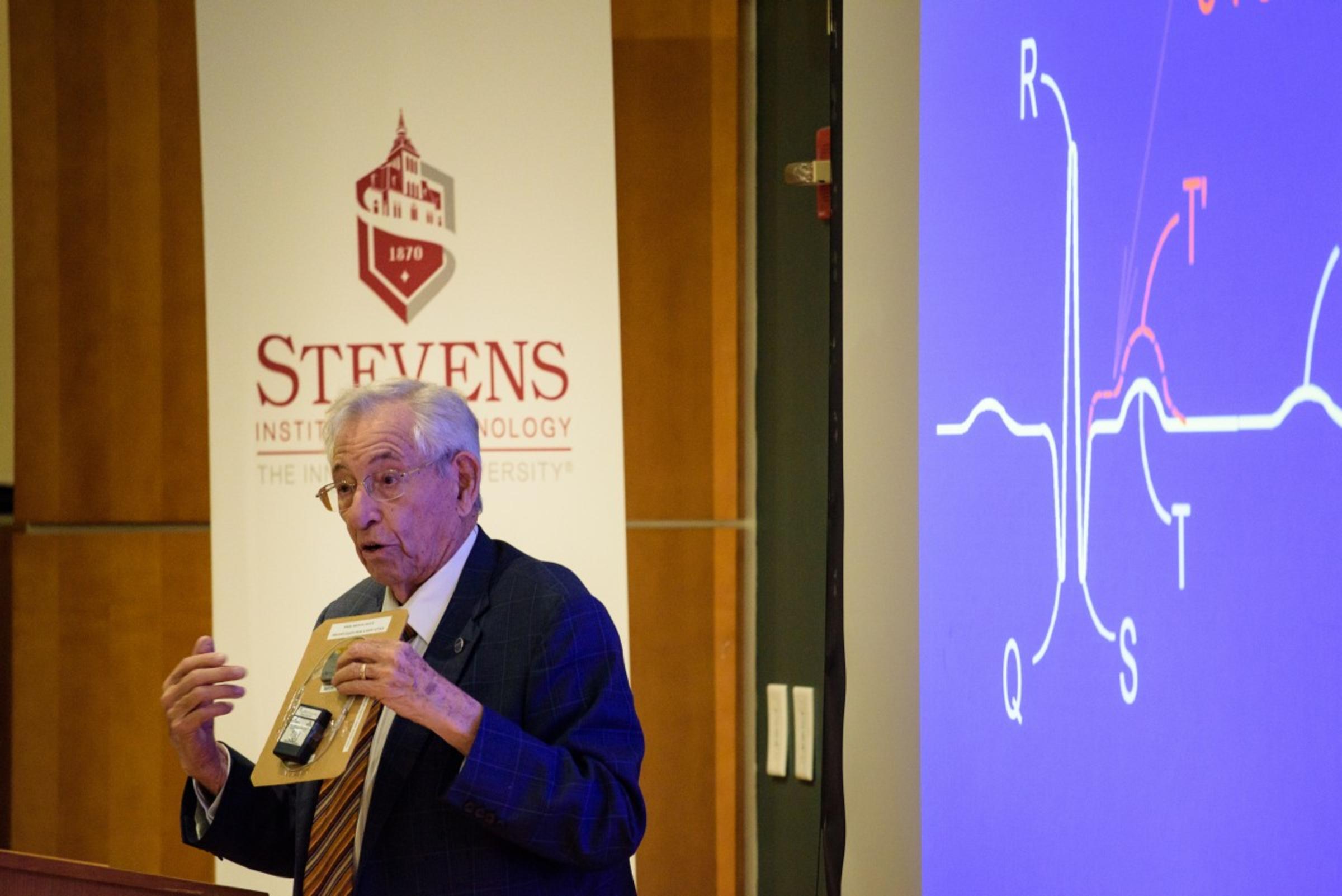 Robert Fischell showing AngelMed Guardian