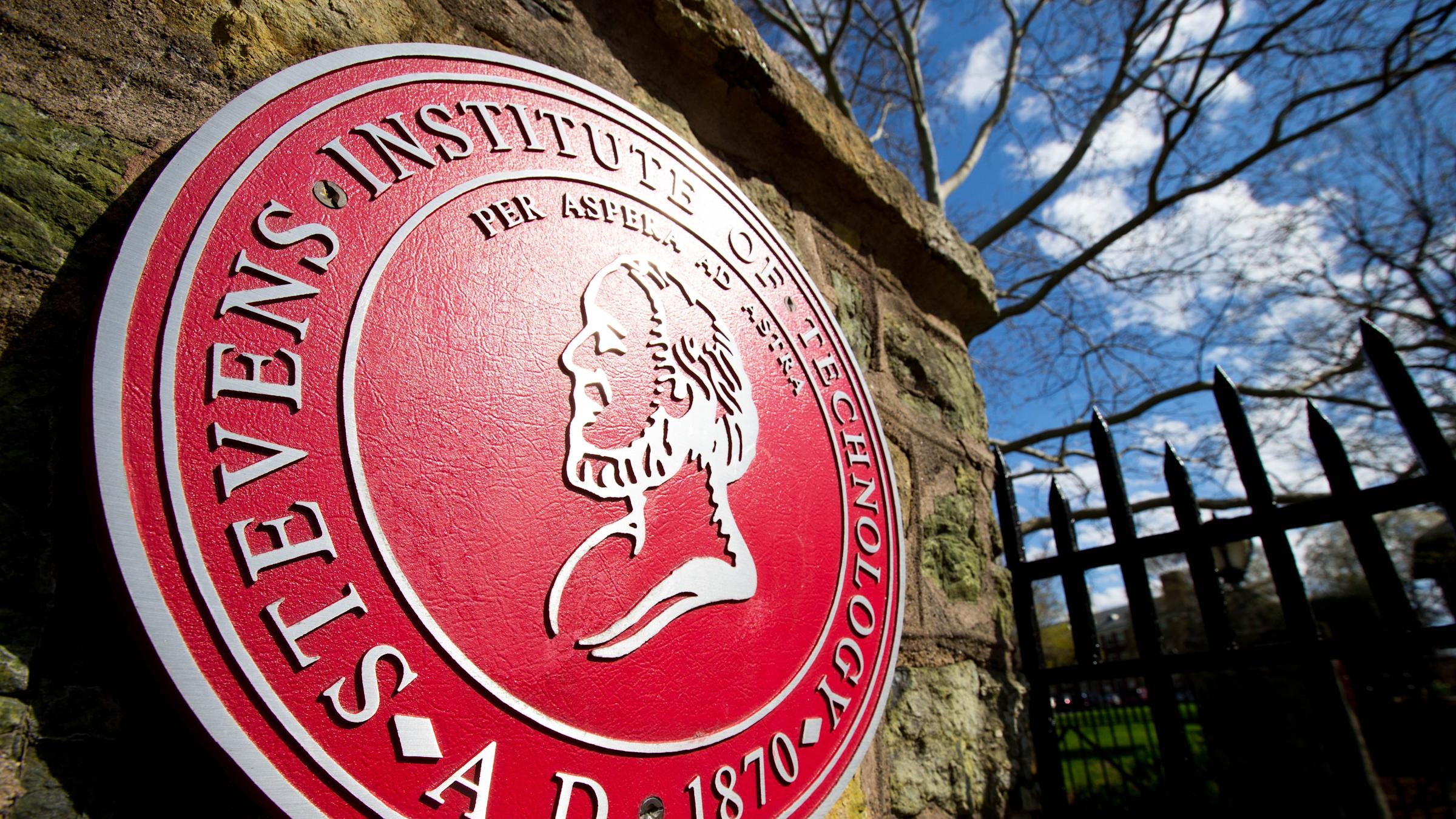 Stevens seal outside the entrance to campus
