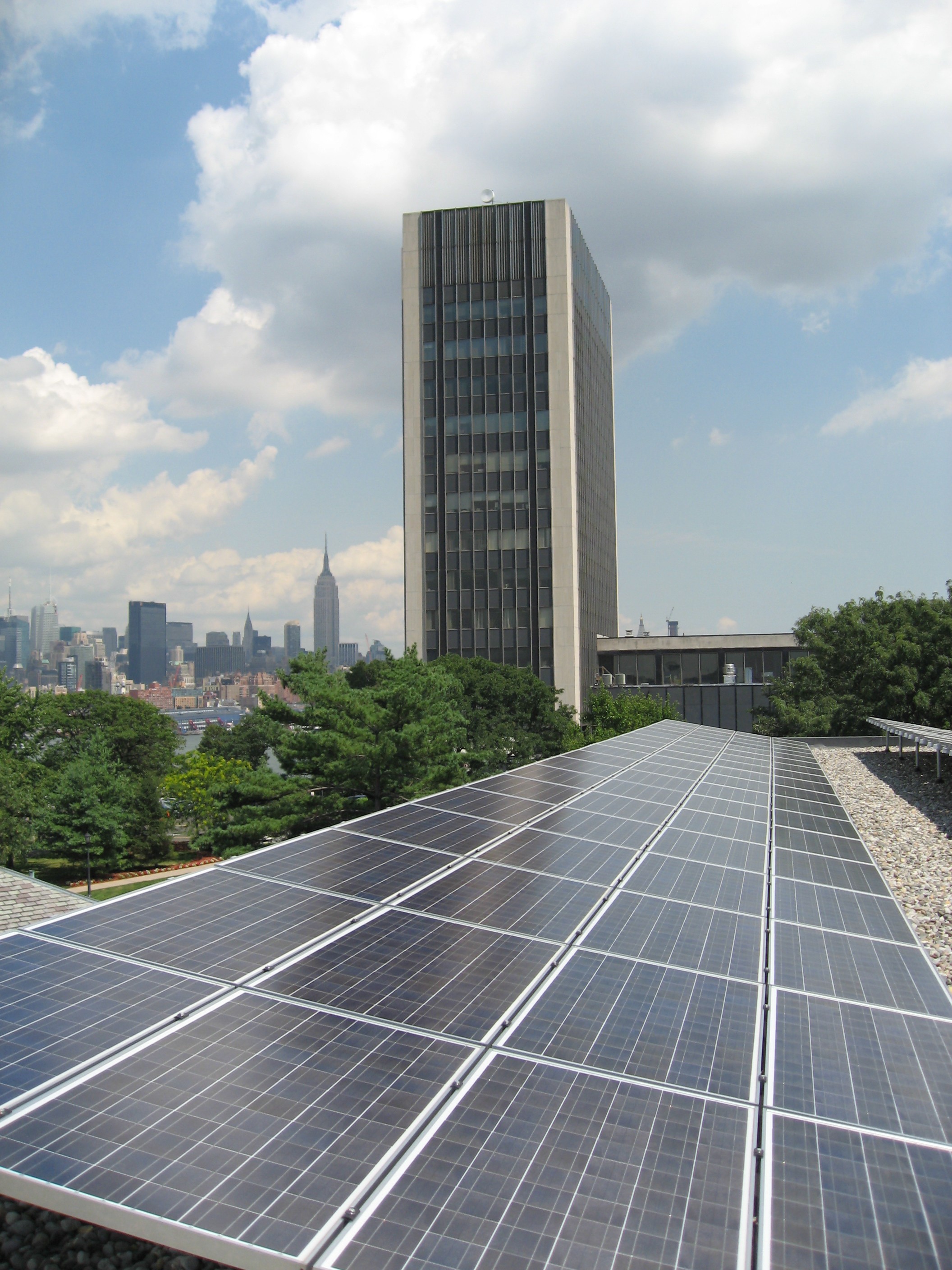 solar array on campus looking east with Manhattan with Howe Building and Manhattan in the background