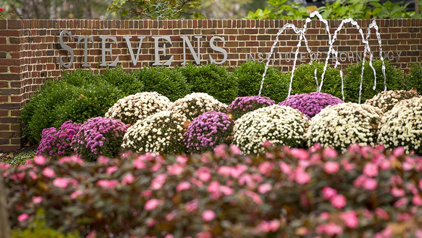 The Stevens fountain and flowers that are arranged before it on the campus.