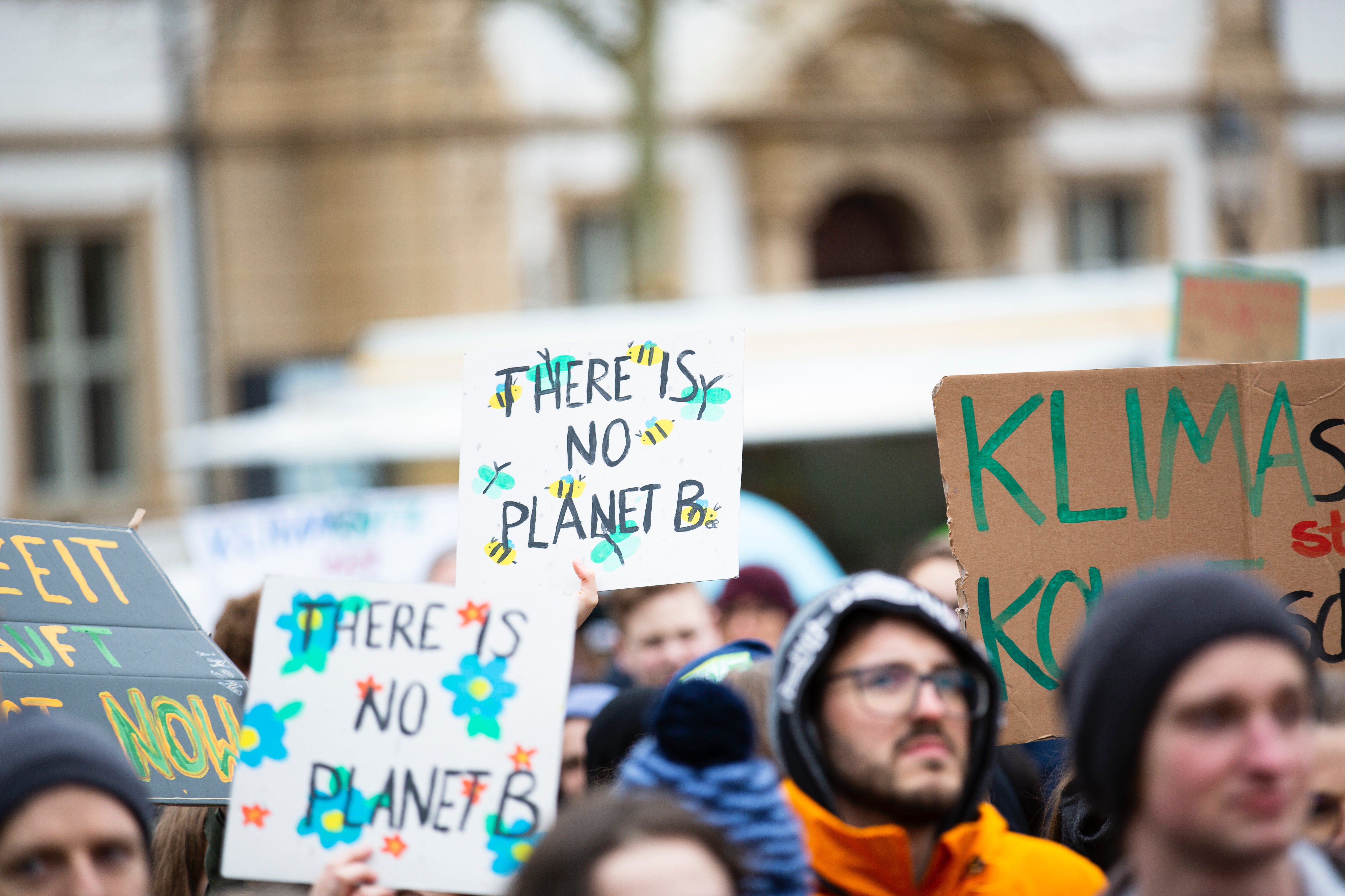 activists with signs that say "there is no planet b" 