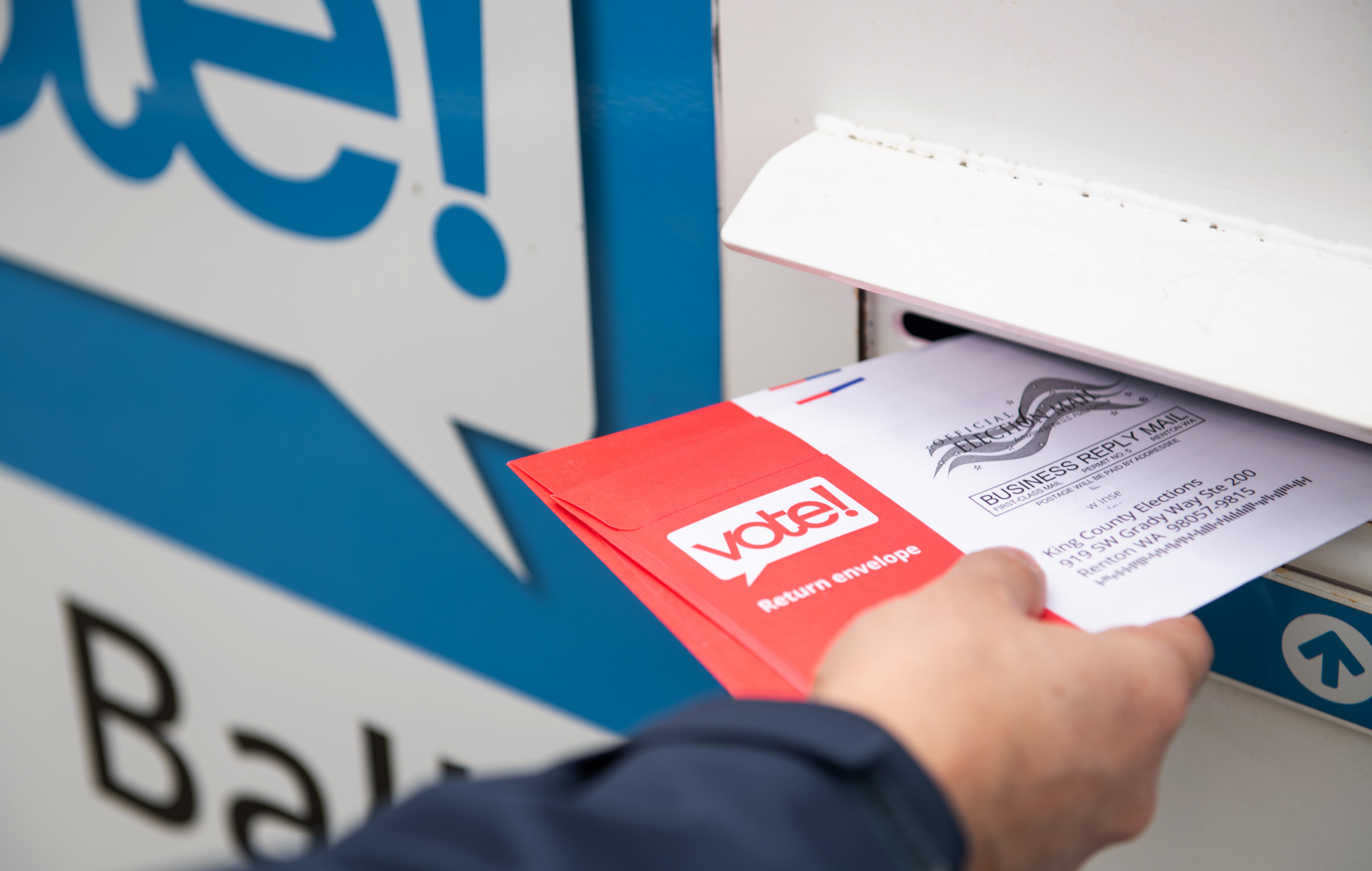 Person mailing an election ballot
