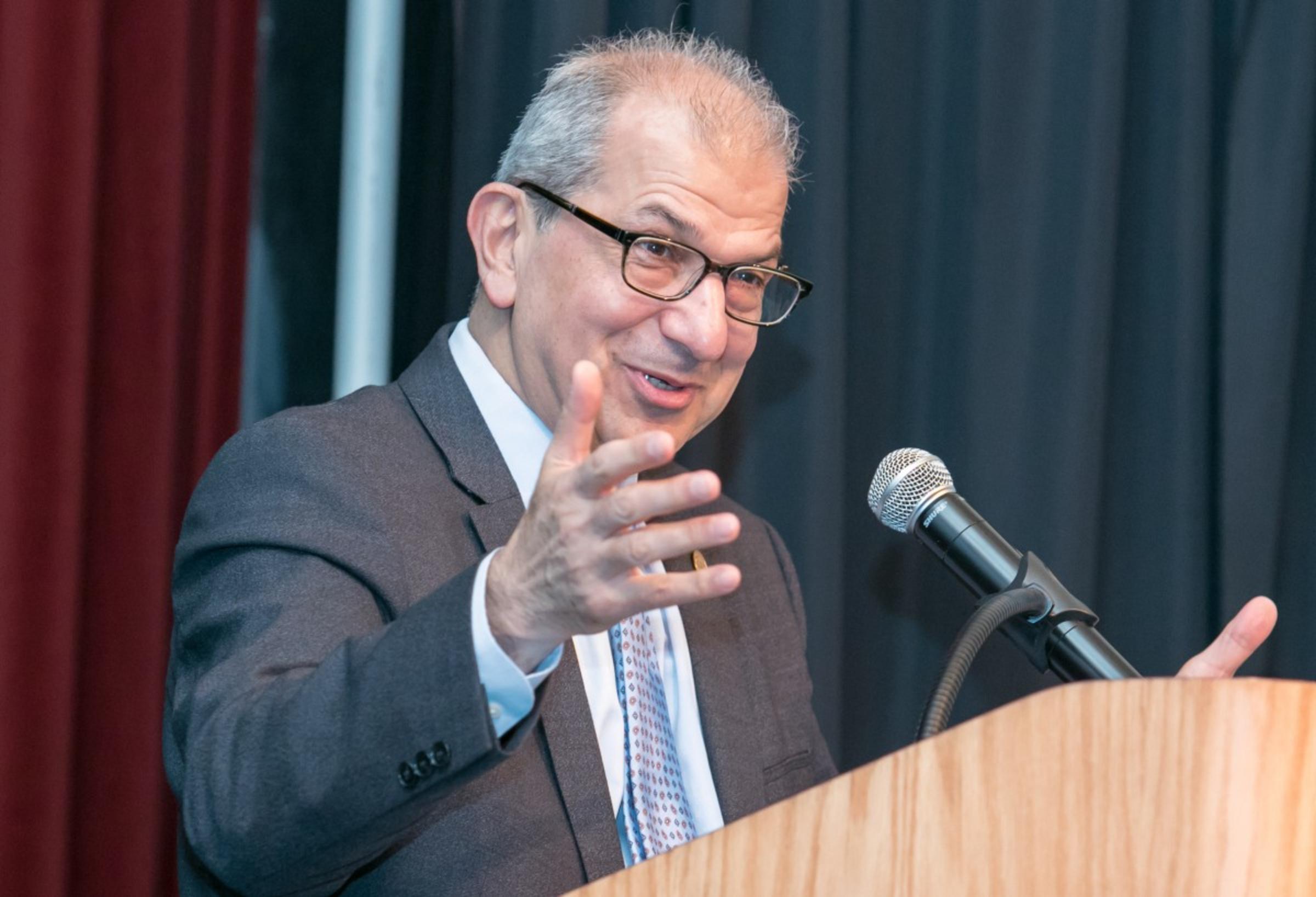 President Nariman Farvardin speaking at podium