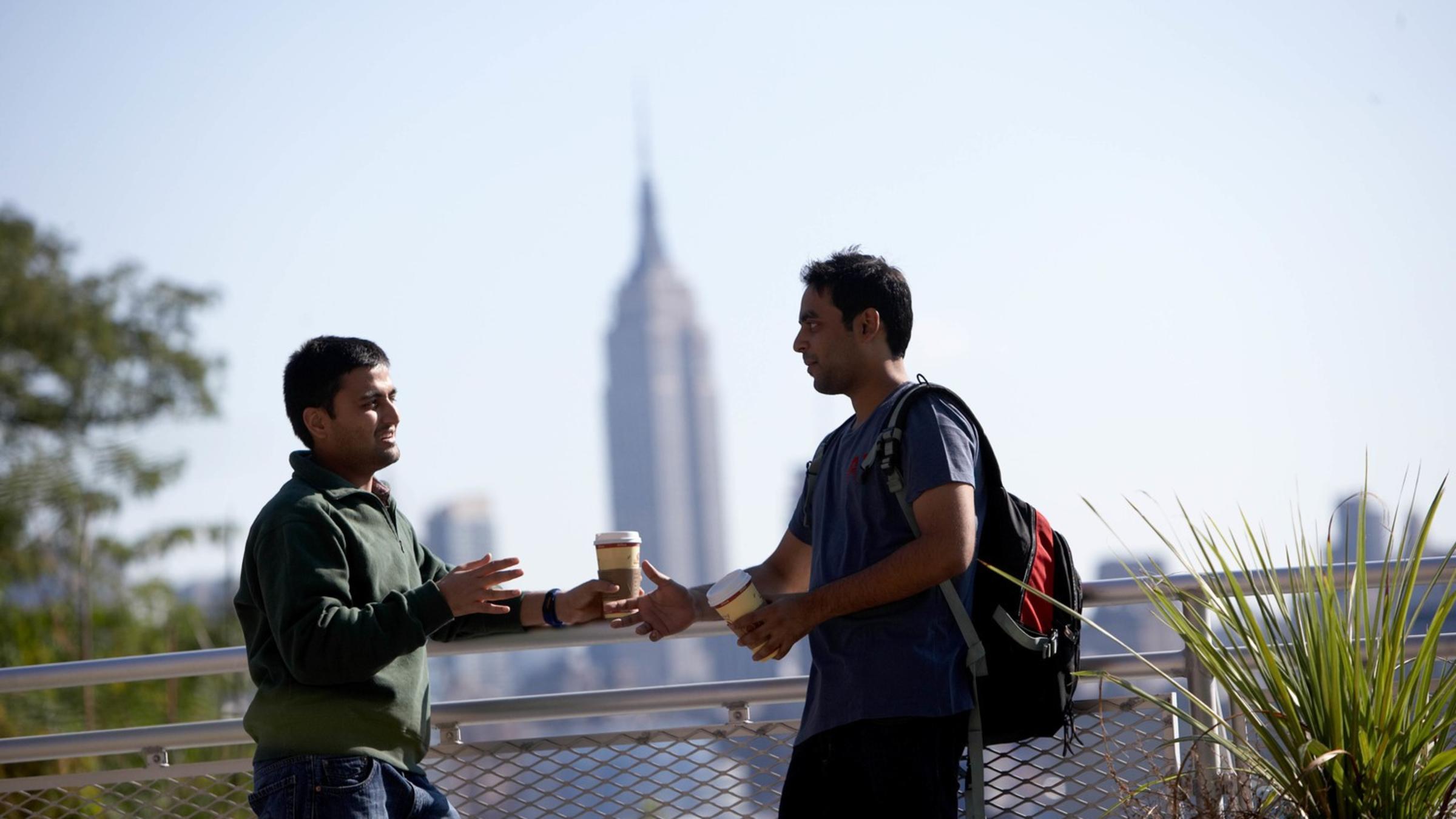 Stevens students on campus with Empire State Building in background