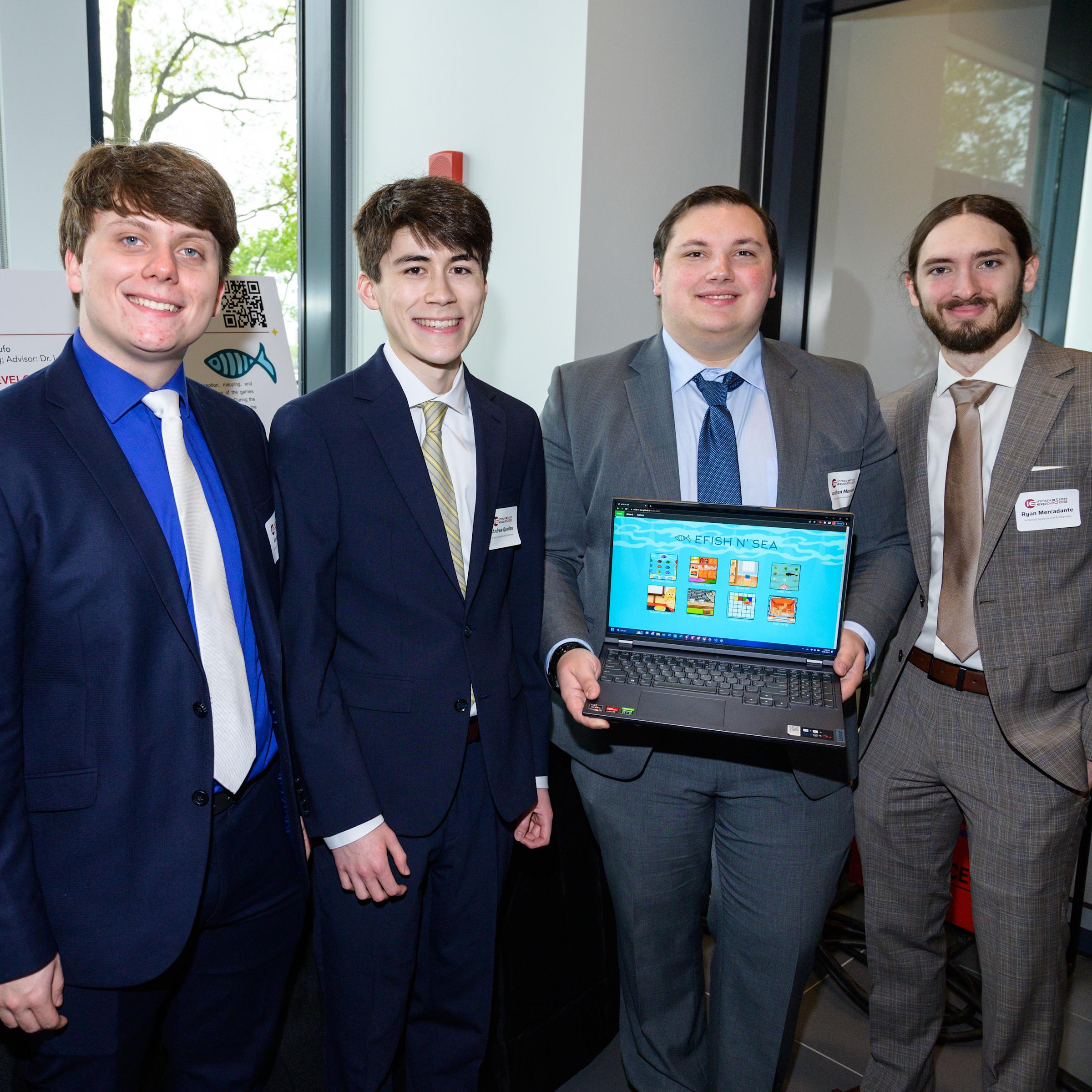 The Software Engineering eFish n' Sea team at the 2023 Innovation Expo. From left to right: Vincent Tufo, Andrew Quinlan, Jonathan Morrone and Ryan Mercadante.