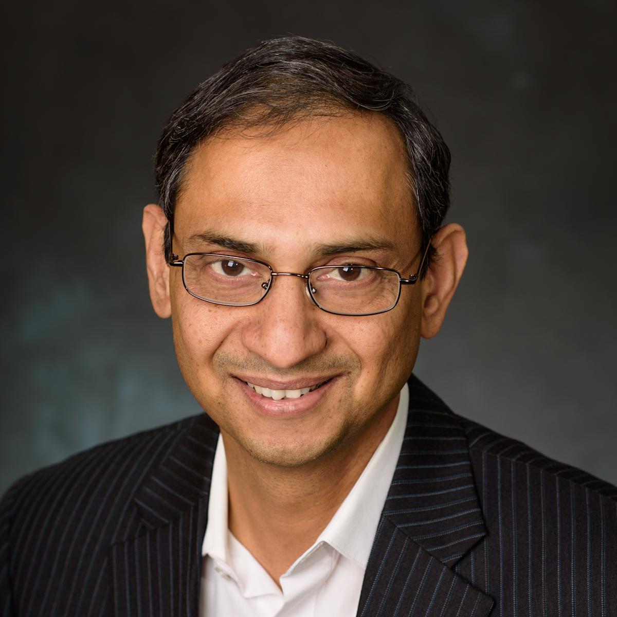 Professional headshot of Kishore Pochiraju