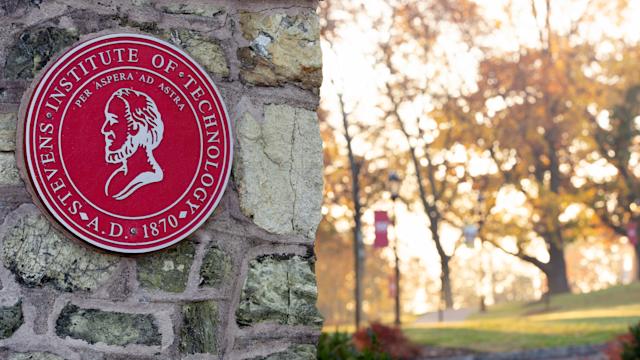 Stevens seal on brick gate on campus