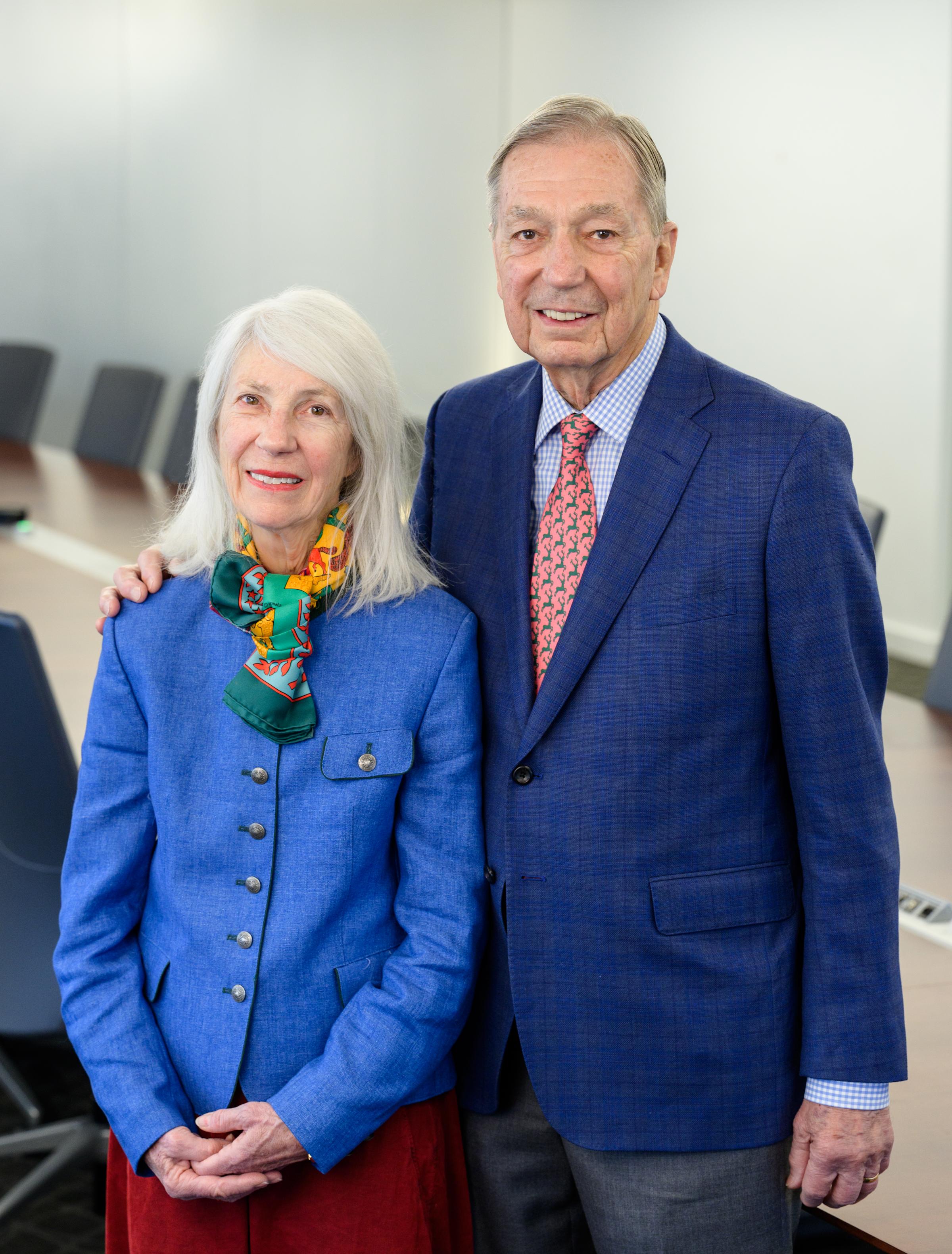 Aimee and Michael Kakos post for a portrait