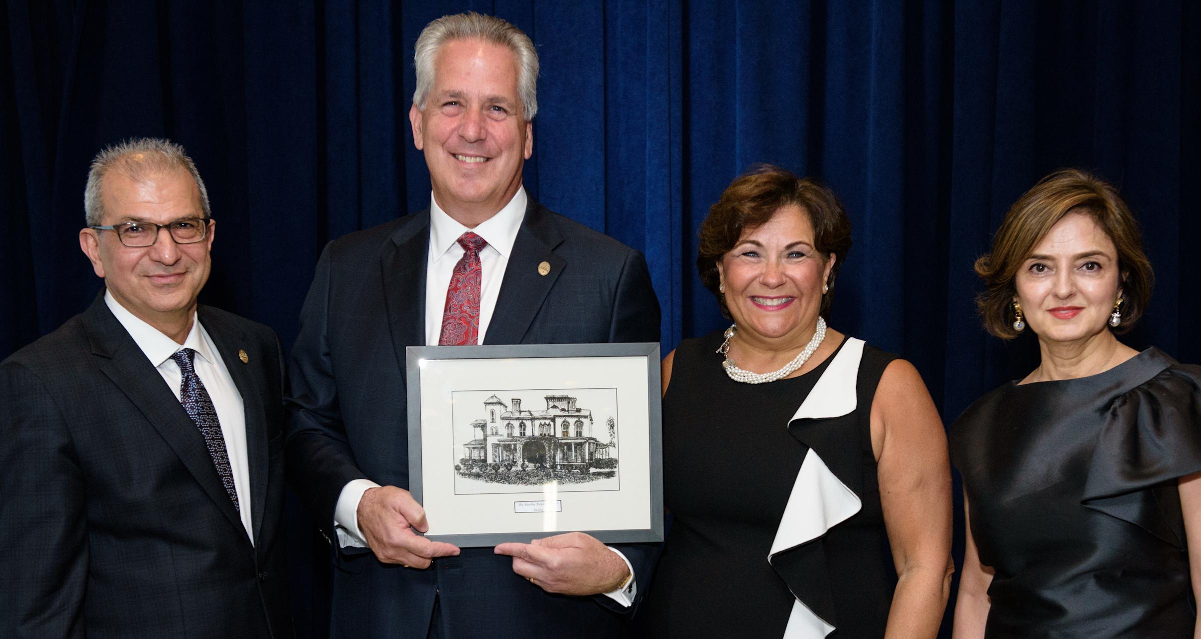 President Nariman Farvardin and Hoveida stand with alumni to recognize their generosity to Stevens