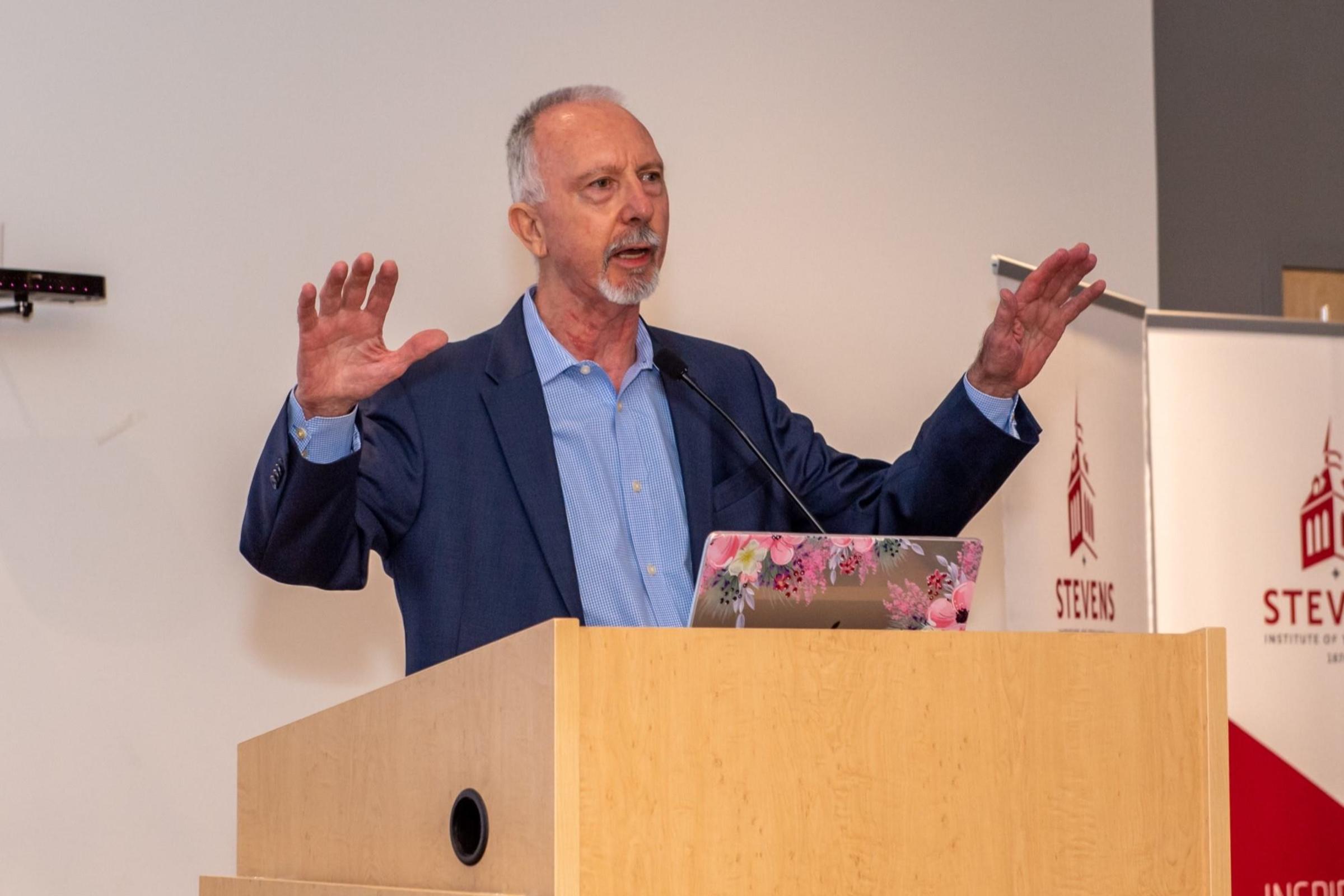Emeritus Professor Keith Sheppard gestures as he speaks at the 2022 SES Faculty Awards