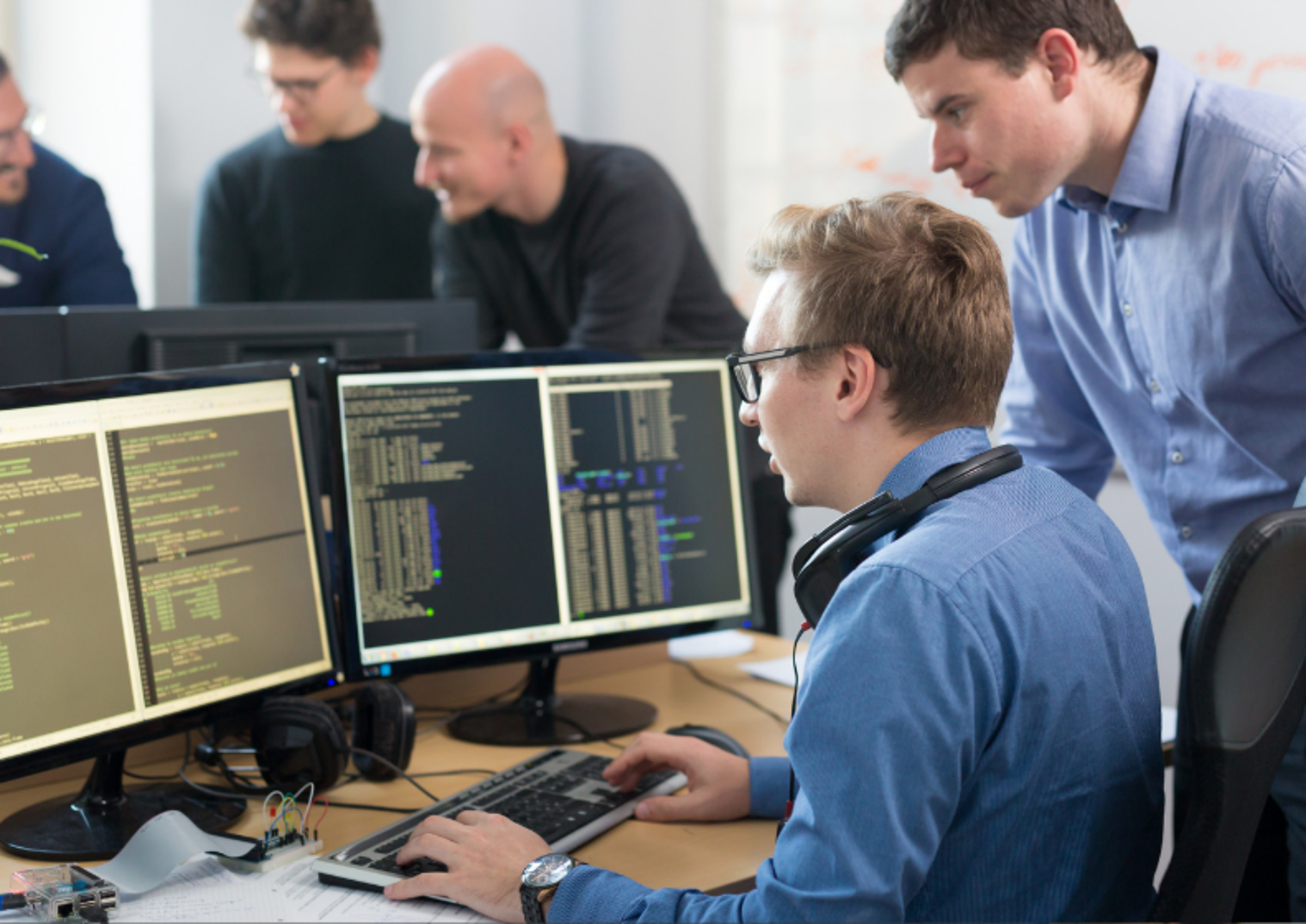 Students at computers looking at code