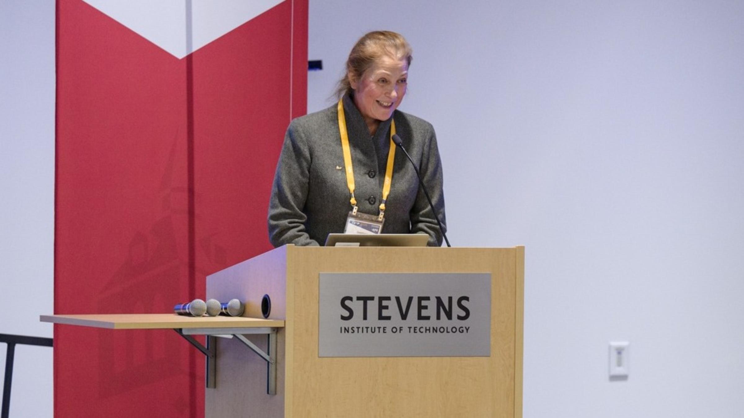 A female faculty professor, Svetlana Malinovskaya hosting a lecture