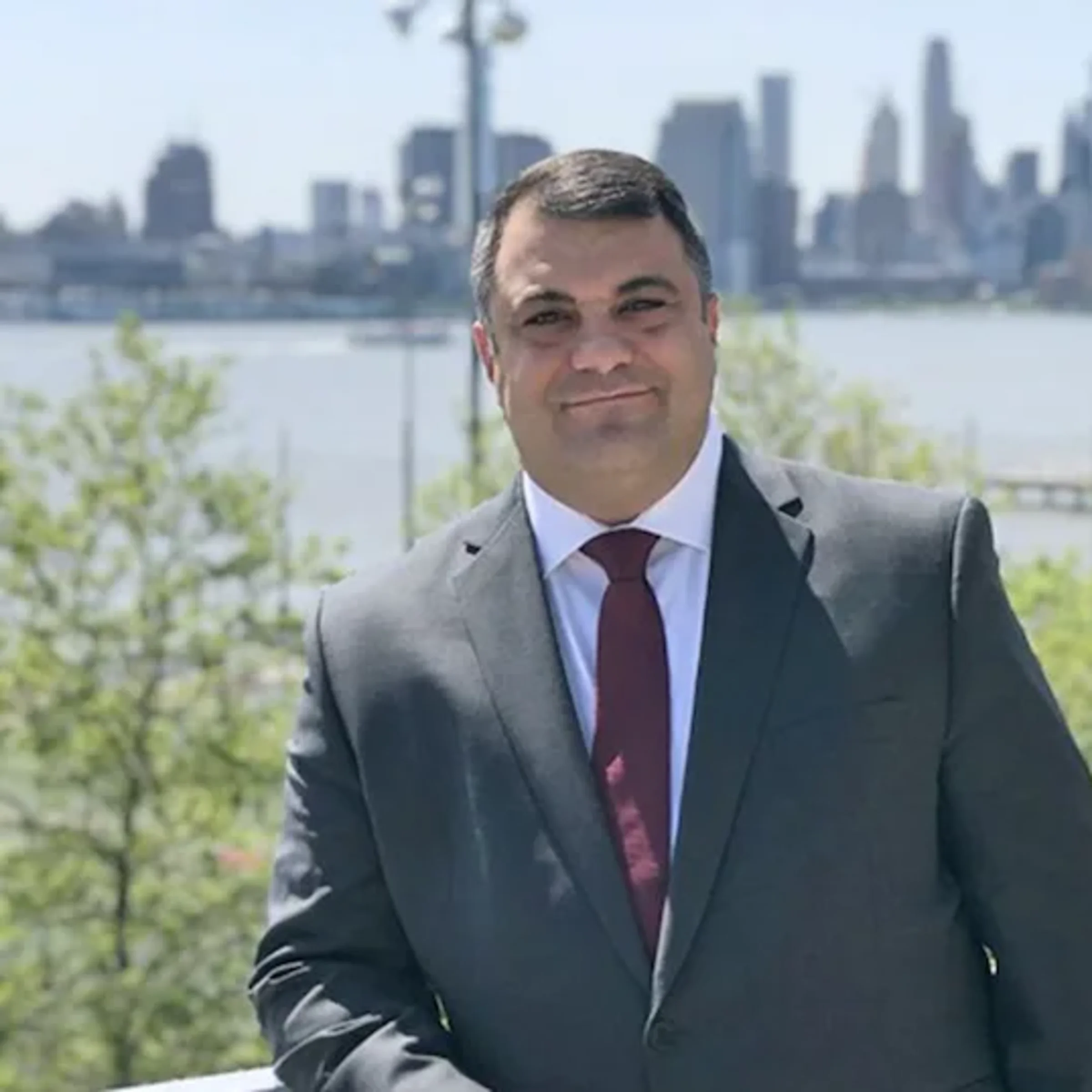 Chris Colla in front of the NYC skyline