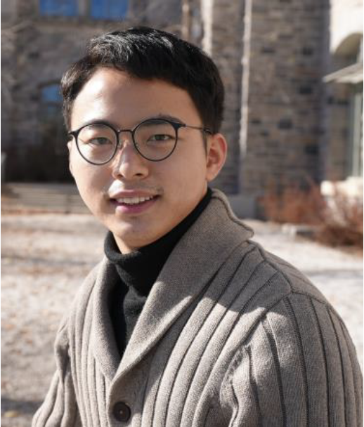 Headshot of Jia Mi wearing glasses and smiling, outside