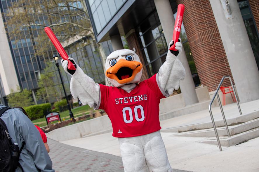 Stevens mascot Attila the duck hulds up wings in celebration