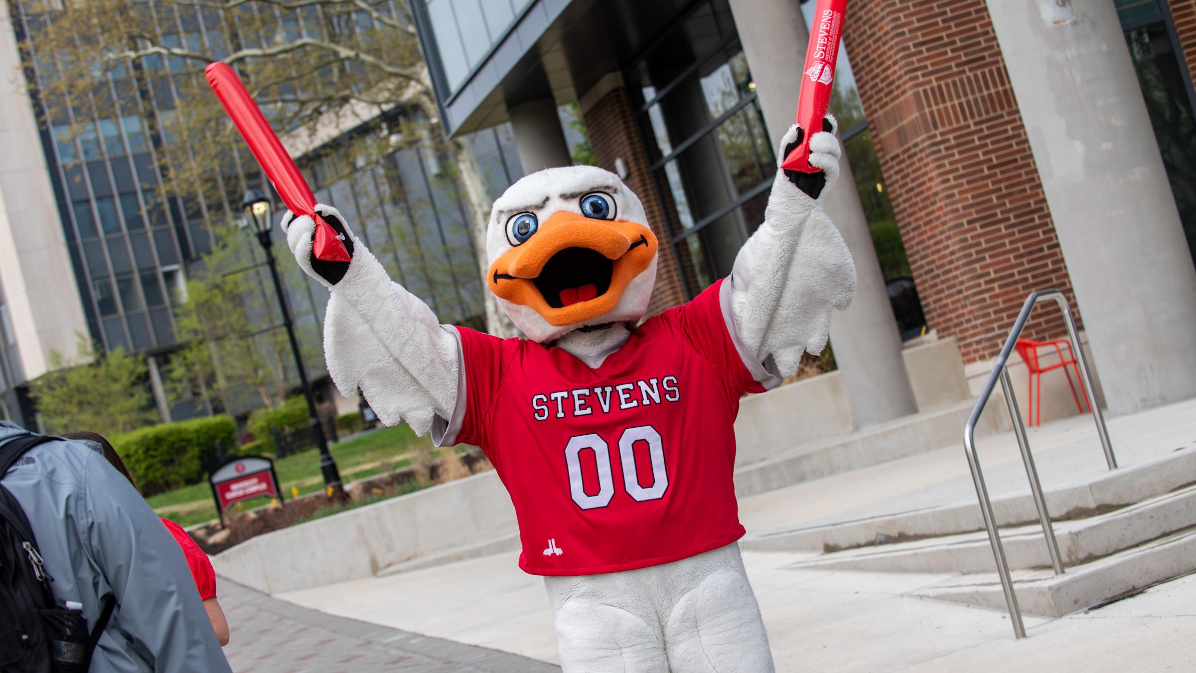 Stevens mascot Attila the duck hulds up wings in celebration