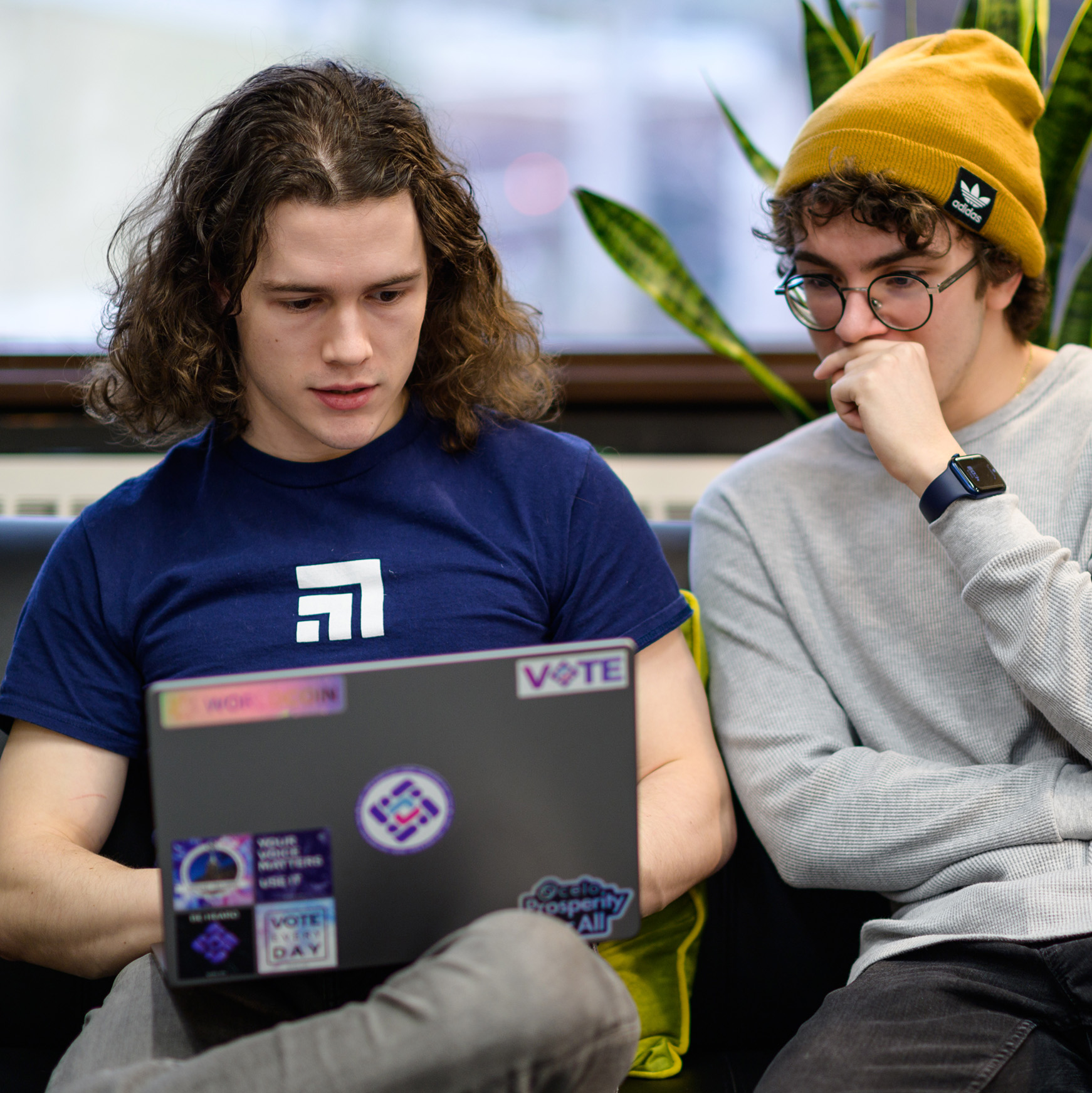 Two iSTEM students collaborate on their laptop