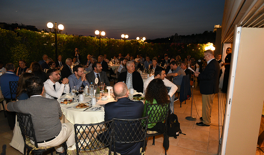School of Business Dean Gregory Prastacos speak during an evening conference dinner 