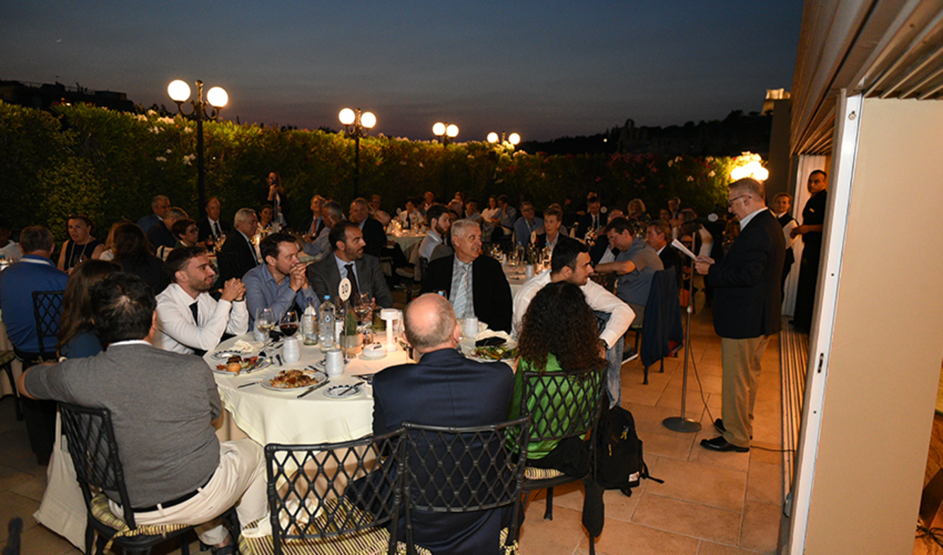 School of Business Dean Gregory Prastacos speak during an evening conference dinner