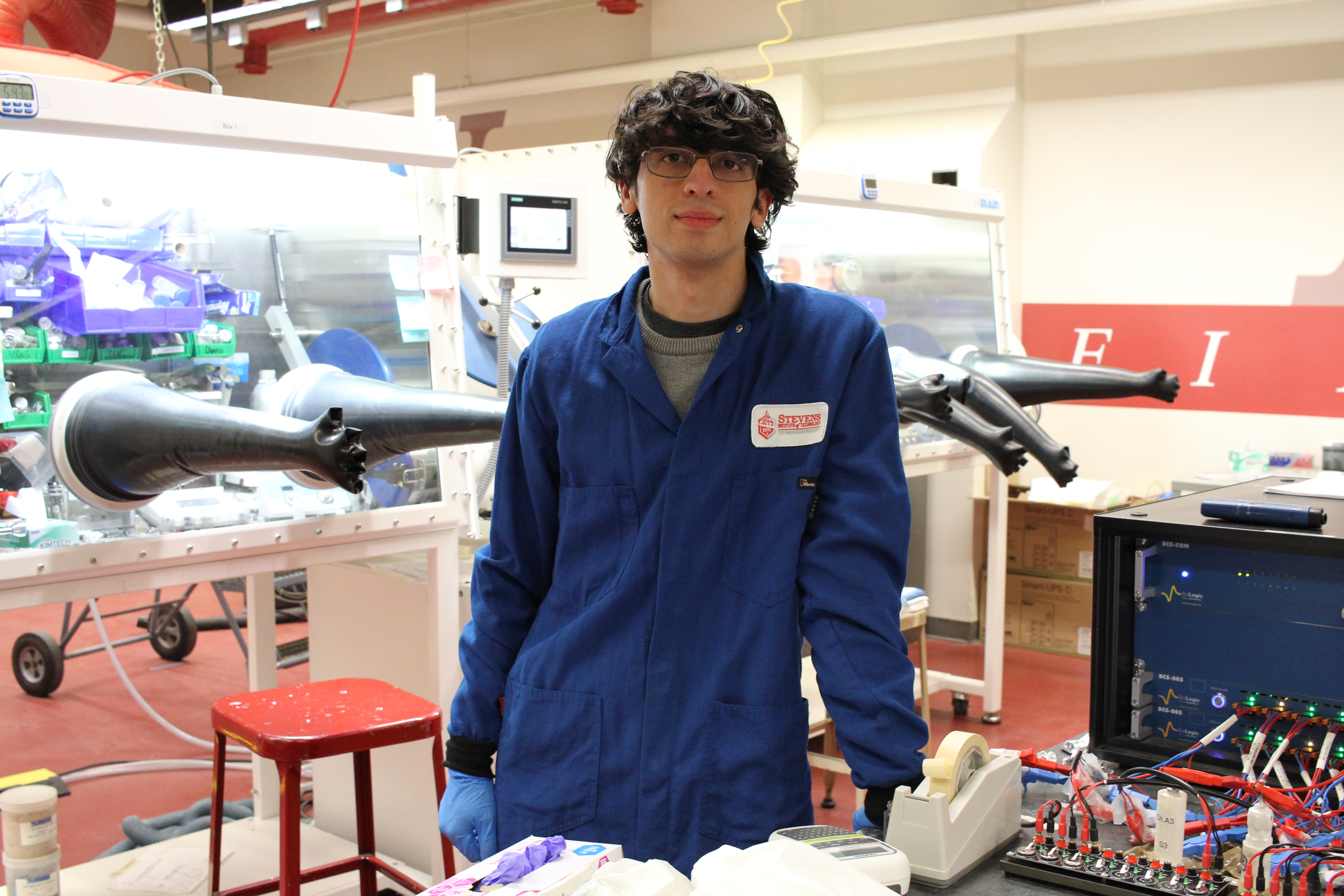 Photo of Angel Burgos in Jae Chul Kim's battery laboratory