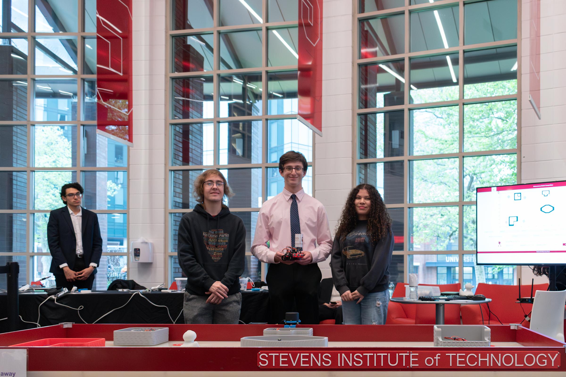 Students pose at the Gallois Autonomous Robot Competition