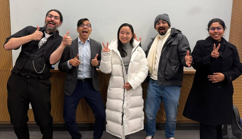 Joseph Helsing (at left), lecturer in the Department of Electrical and Computer Engineering at Stevens and students Atif Qadir, Xirui Yu, Shivam Raj, and Titir Talukder standing in front of a whiteboard.. 