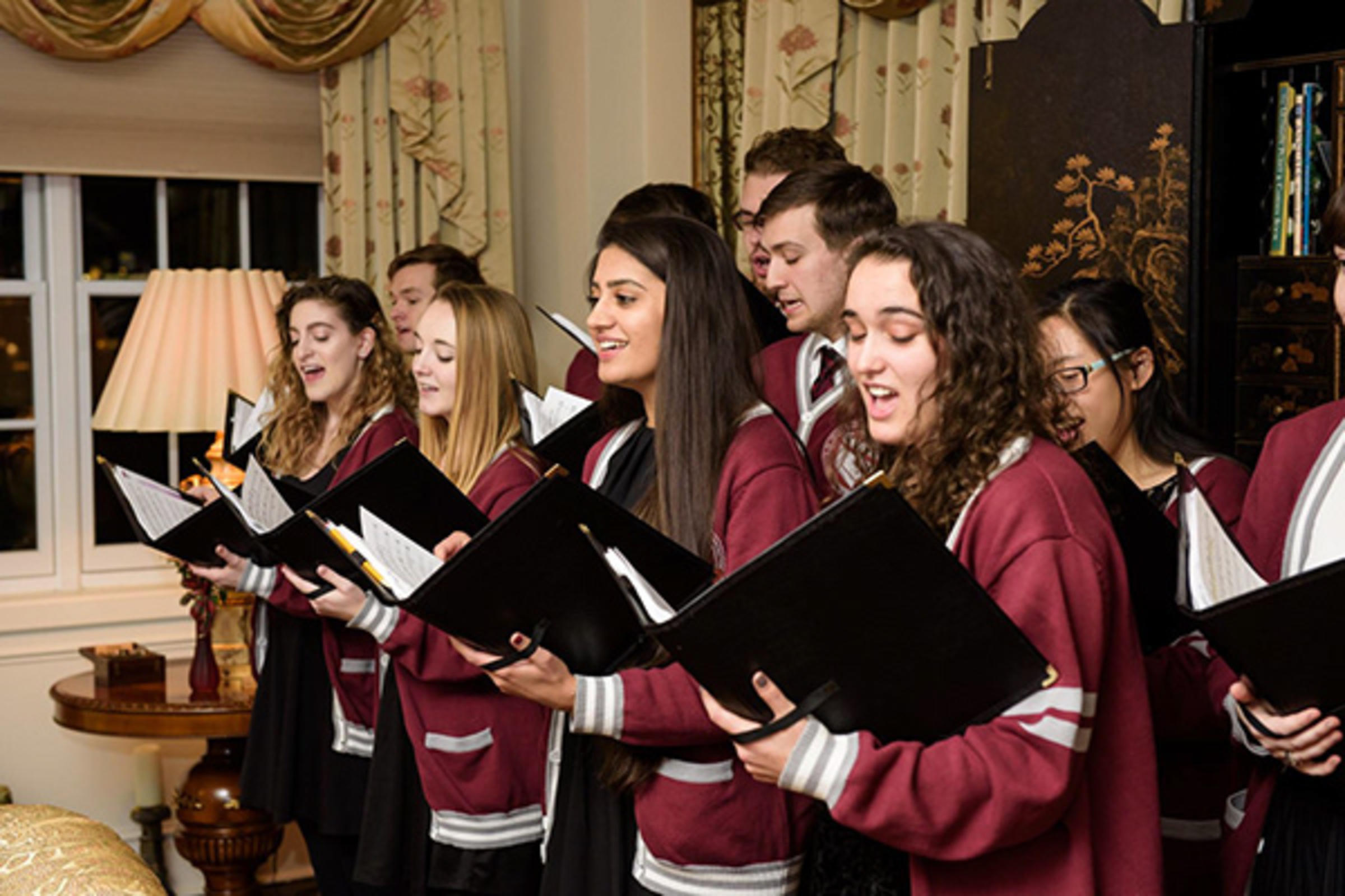 Moenika Chowdhury singing as part President's Ensemble