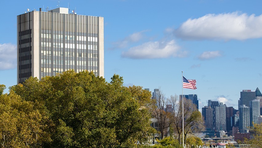 aerial photo of Stevens campus featuring the Howe Center and the American flag