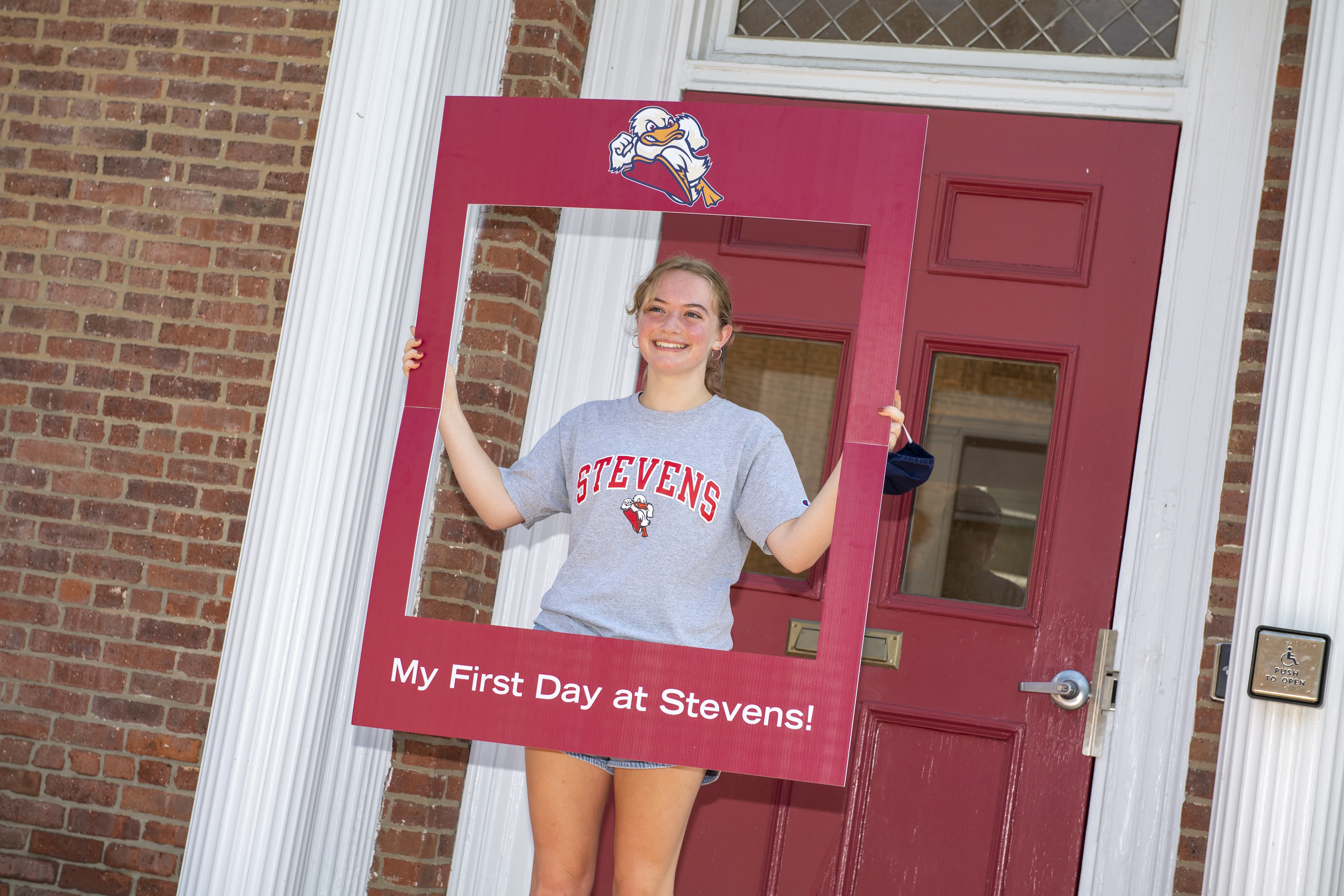 student taking photo on campus