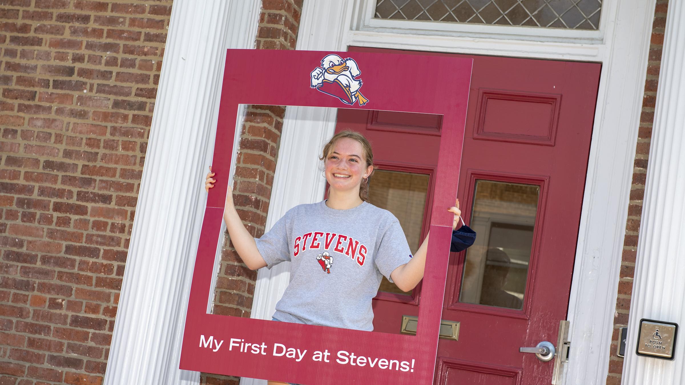 student taking photo on campus