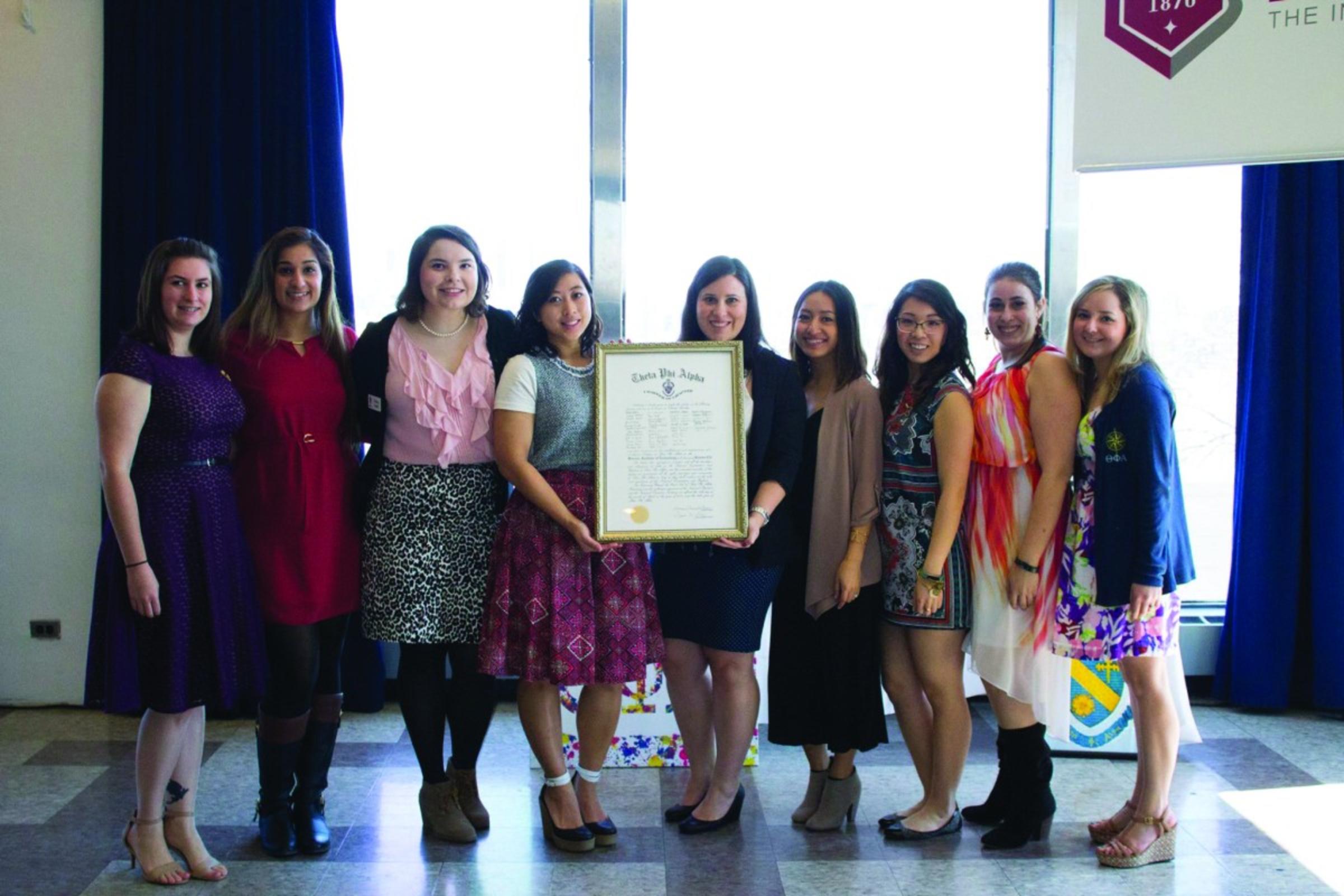 Kristine Du ’12 (fourth from left) pictured with sisters of Theta Phi Alpha at the fifth anniversary celebration of the sorority’s Founder’s Day.