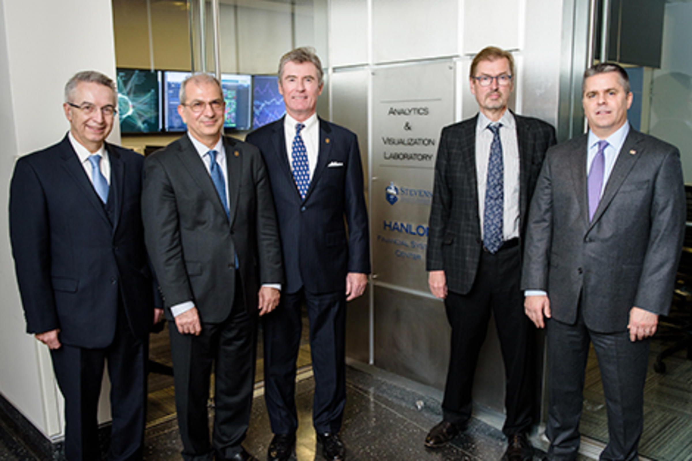 Stevens leadership outside the new lab facility.